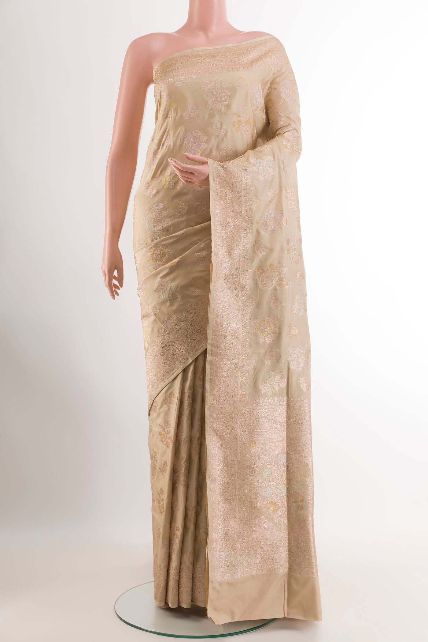 Cream Banarasi Silk Saree with Zari Brocade on the body and Zari Border.  displayed on a mannequin