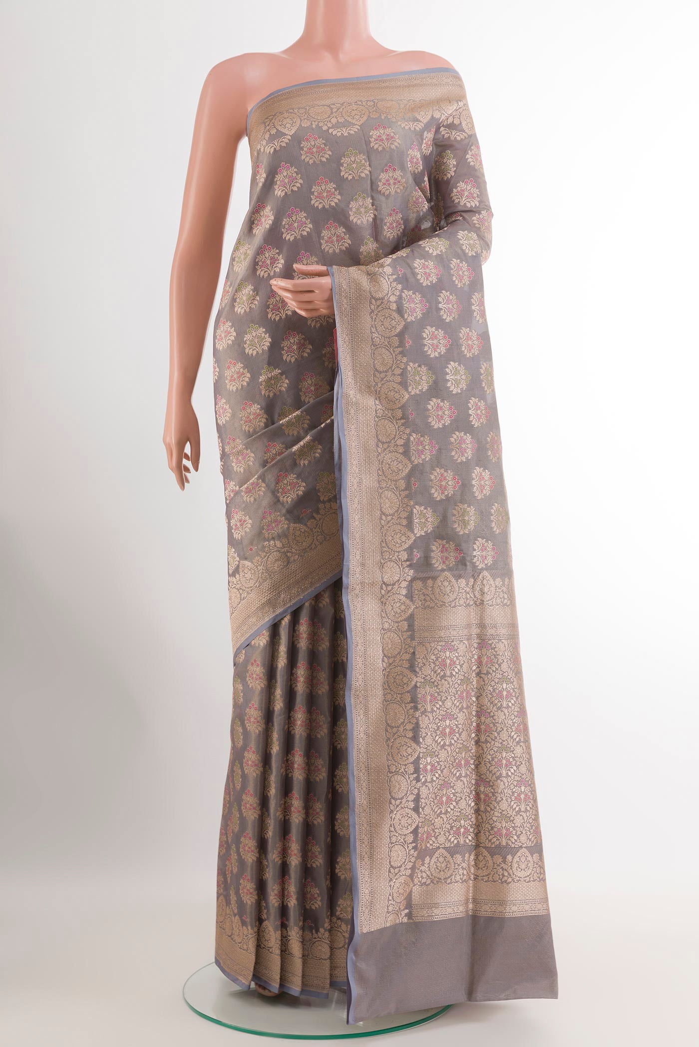 Grey Banarasi Silk Saree with Zari Butta on the body and Zari Border.  displayed on a mannequin
