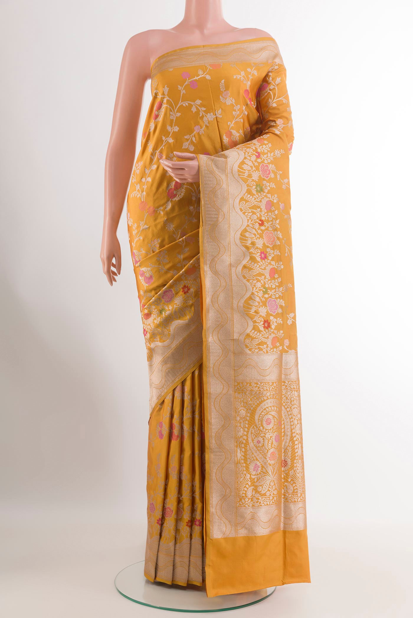 Yellow Banarasi Silk Saree with Zari Brocade on the body and Zari Border.  displayed on a mannequin