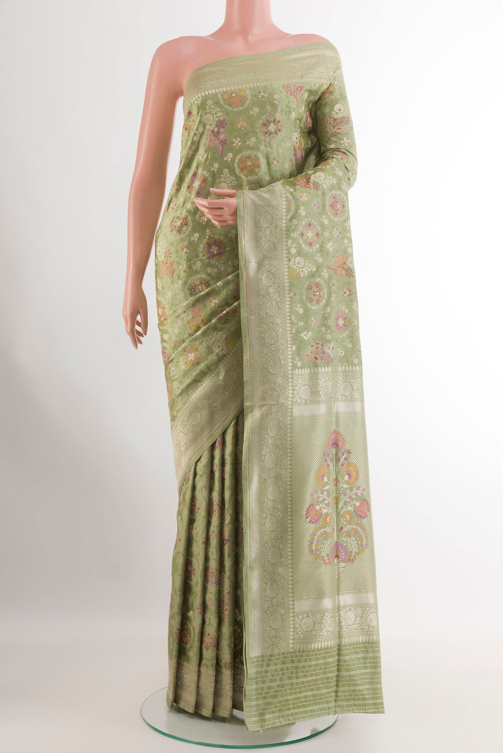 Green Banarasi Silk Saree with Zari Brocade on the body and Zari Border.  displayed on a mannequin