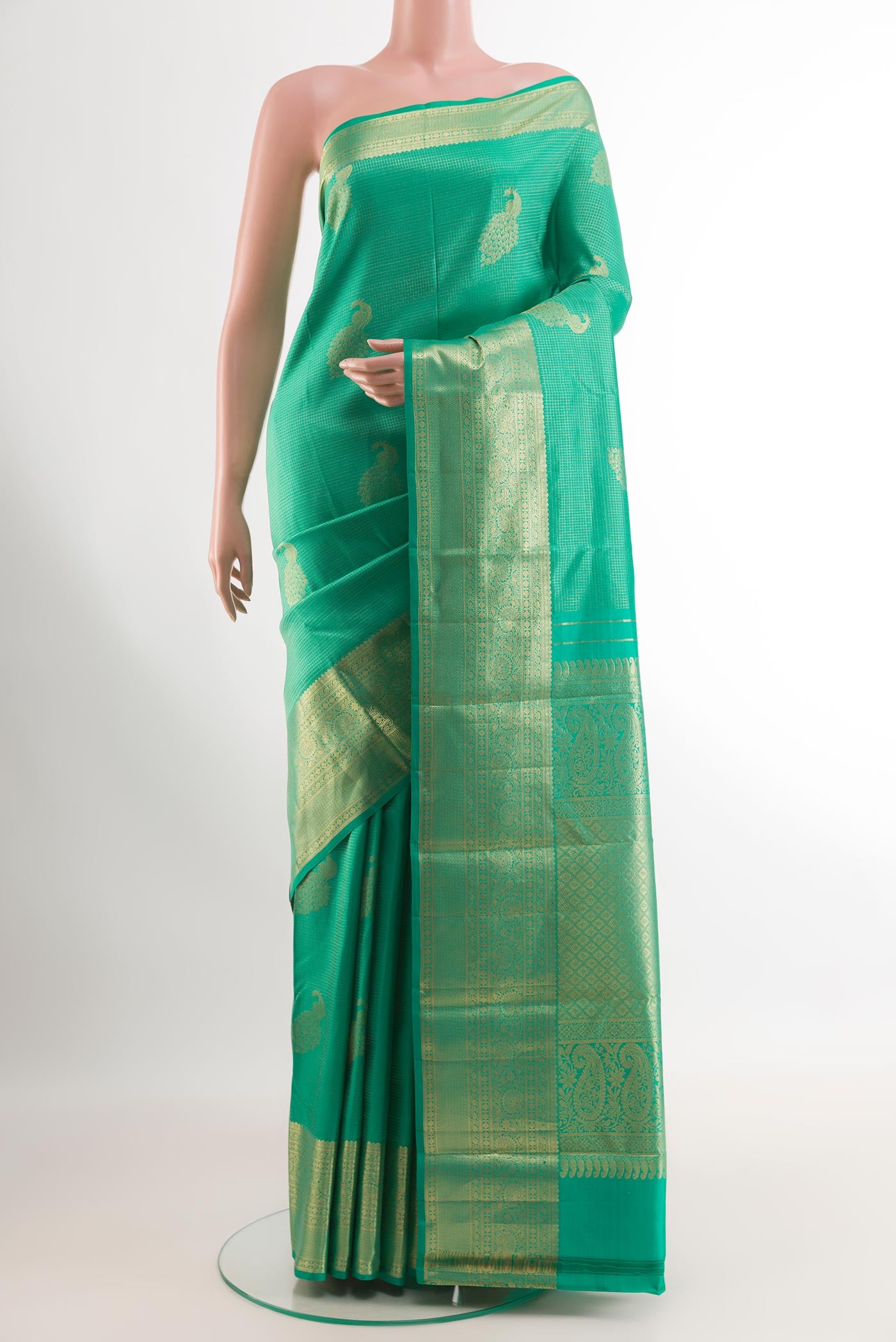Sea Green Kanjivaram Silk Saree with Zari Brocade on the body and Zari Border.  displayed on a mannequin