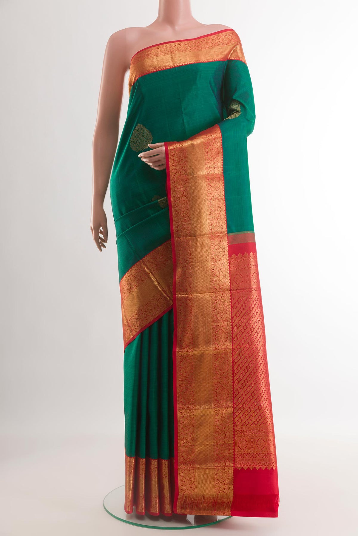 Teal Kanjivaram Silk Saree with Zari Butta on the body and Zari Border.  displayed on a mannequin