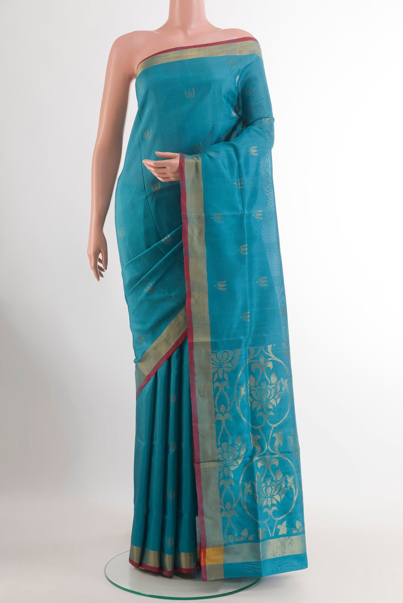 Blue Uppada Silk Saree with Zari Butta on the body and Zari Border.  displayed on a mannequin
