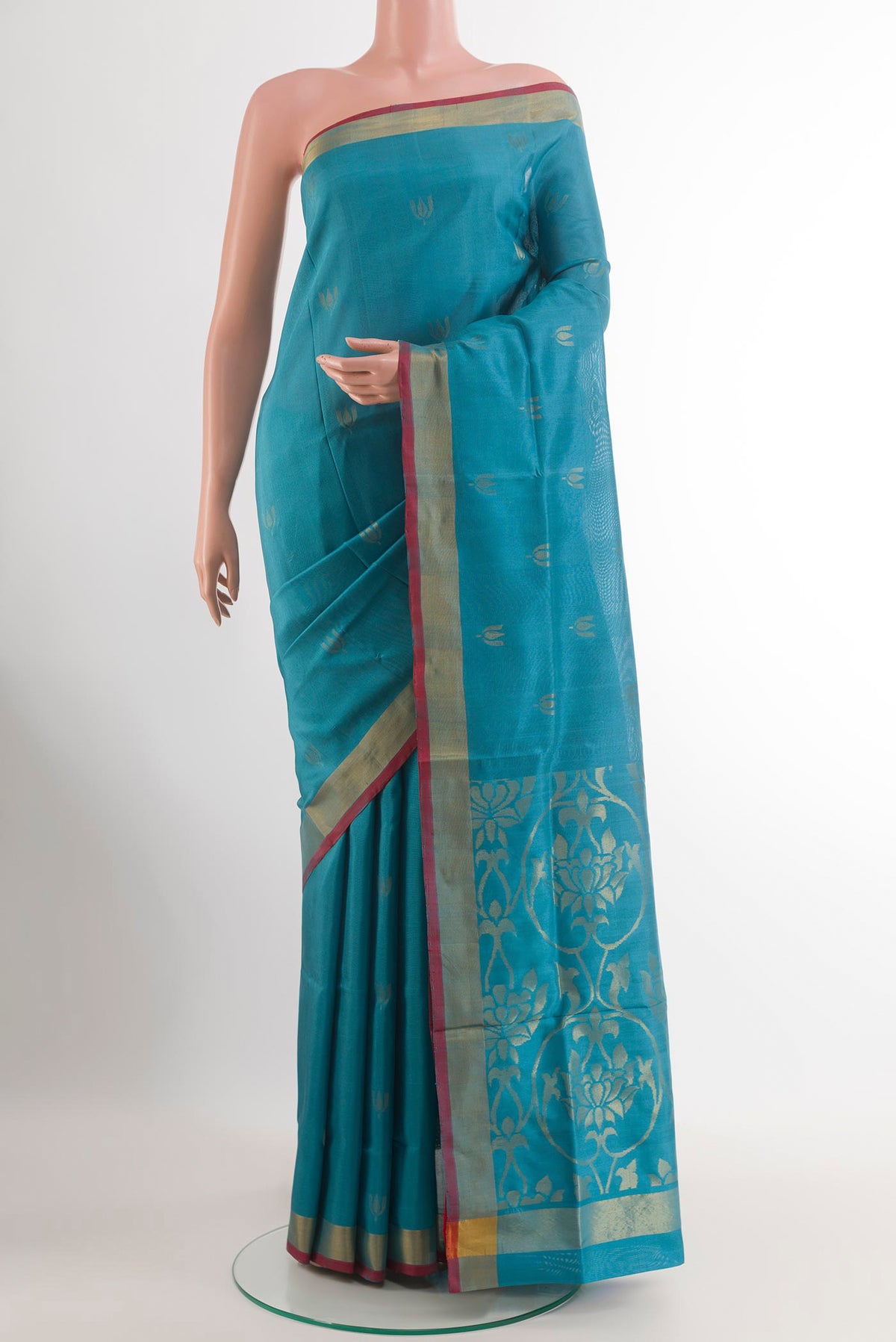 Blue Uppada Silk Saree with Zari Butta on the body and Zari Border.  displayed on a mannequin