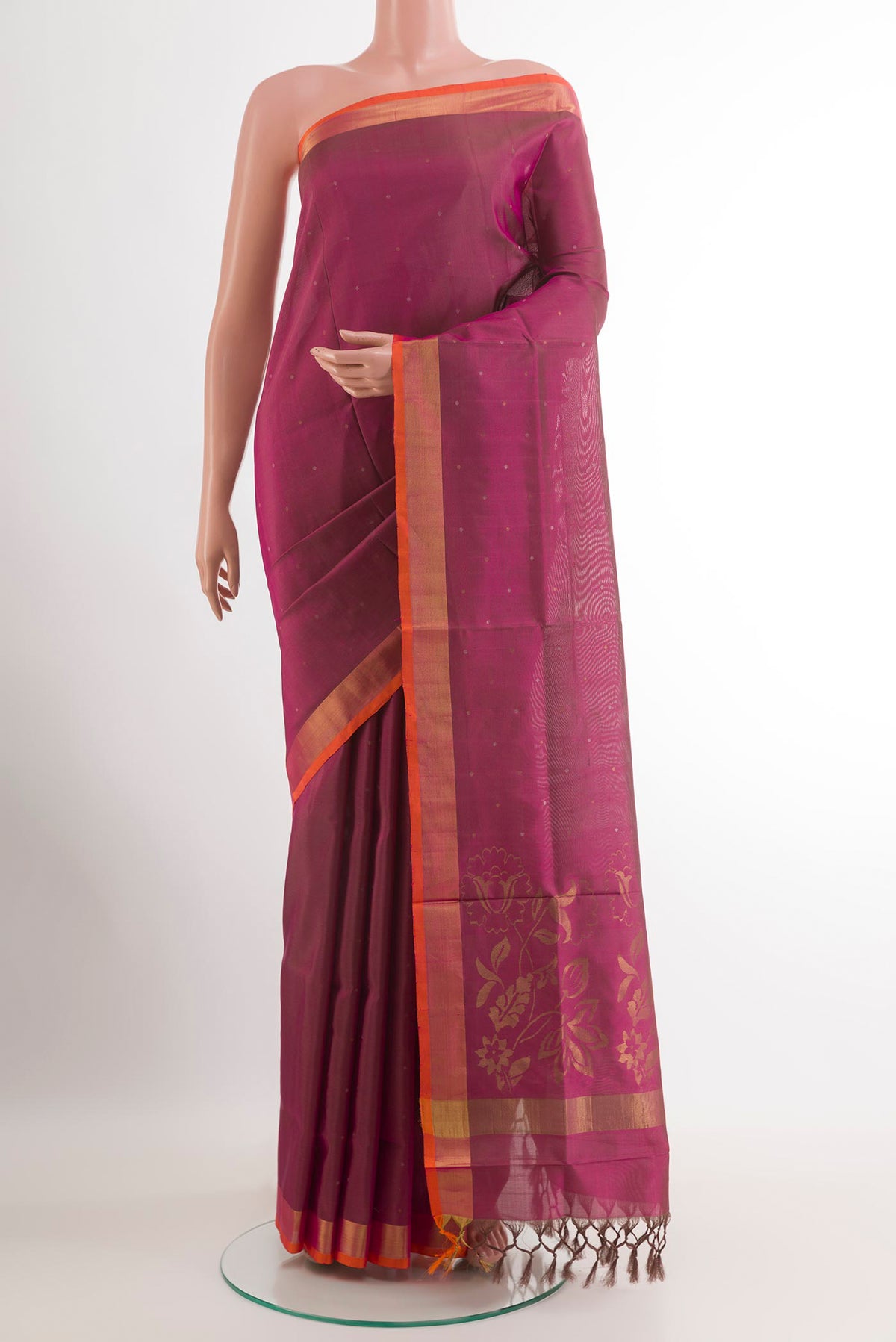 Purple Uppada Silk Saree with Zari Butta on the body and Zari Border.  displayed on a mannequin