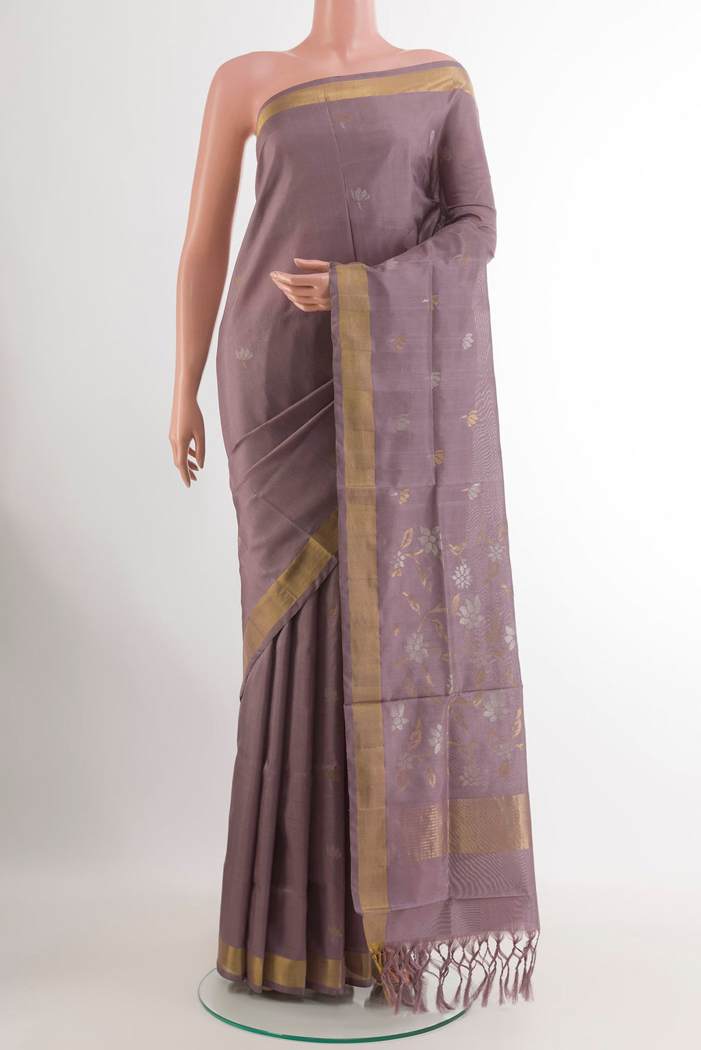 Lavender Uppada Silk Saree with Zari Butta on the body and Zari Border.  displayed on a mannequin