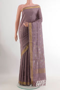 Lavender Uppada Silk Saree with Zari Butta on the body and Zari Border.  displayed on a mannequin
