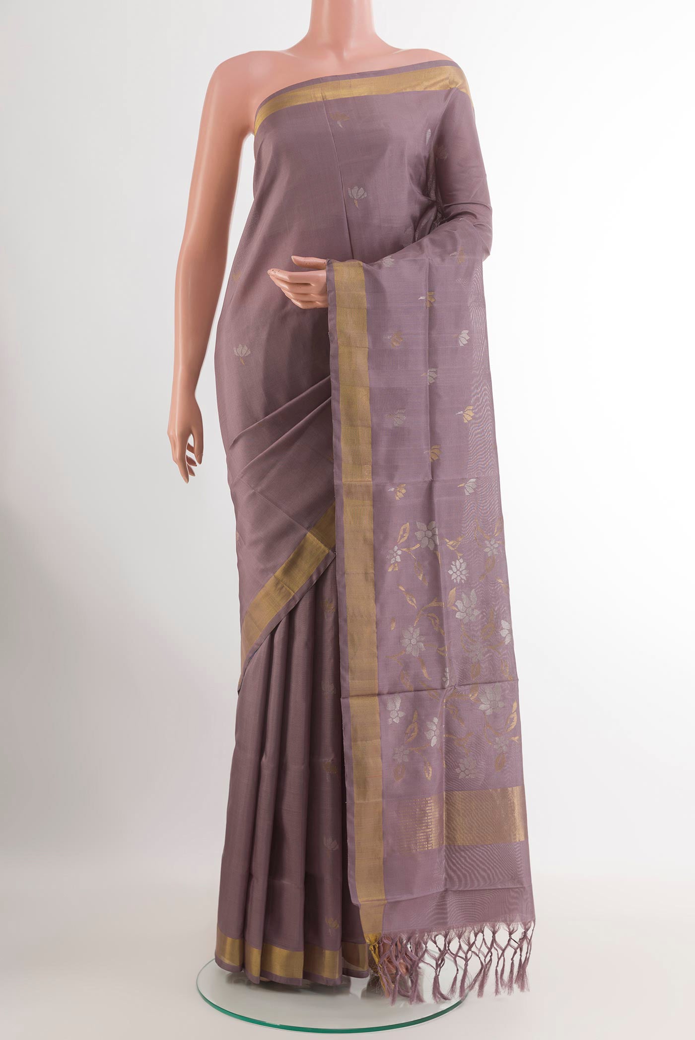 Lavender Uppada Silk Saree with Zari Butta on the body and Zari Border.  displayed on a mannequin