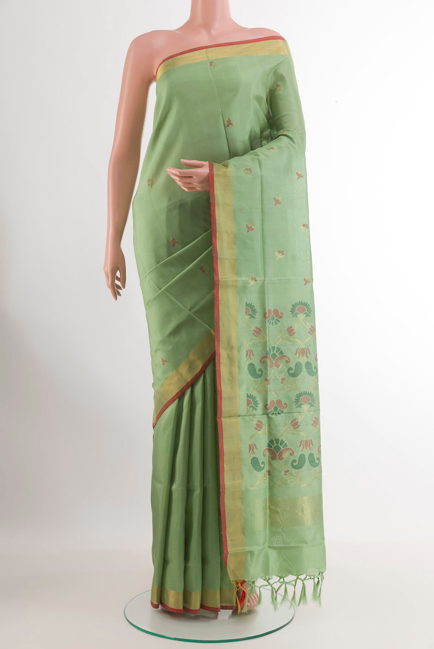 Green Uppada Silk Saree with Zari Butta on the body and Zari Border.  displayed on a mannequin
