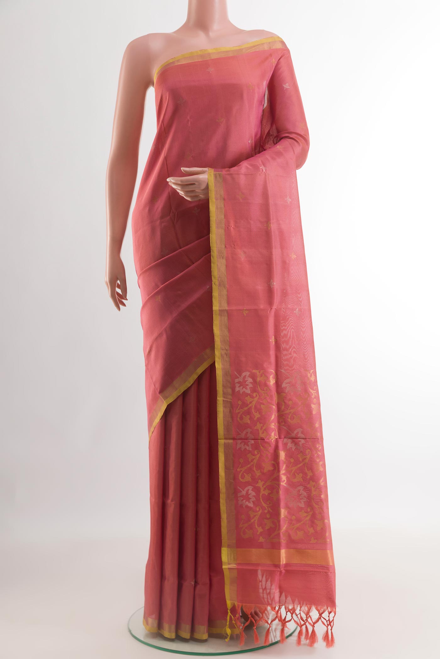 Coral Uppada Silk Saree with Zari Butta on the body and Zari Border.  displayed on a mannequin