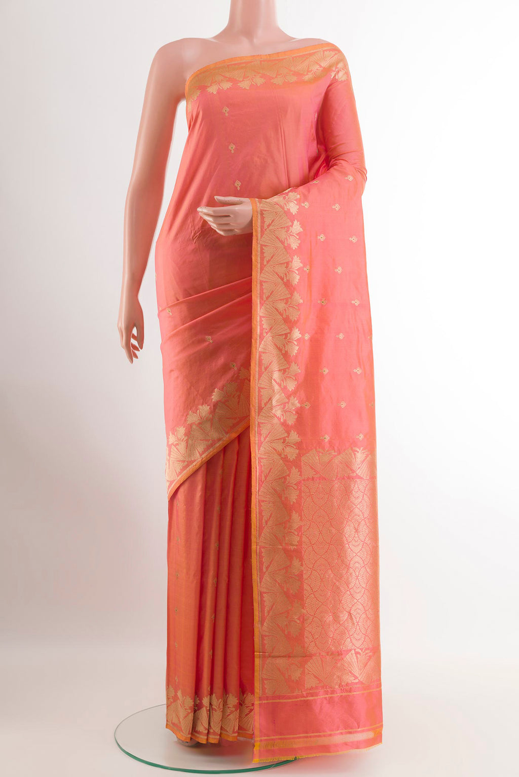 Peach Banarasi Katan Silk Saree with Zari Butta on the body and Zari Border.  displayed on a mannequin