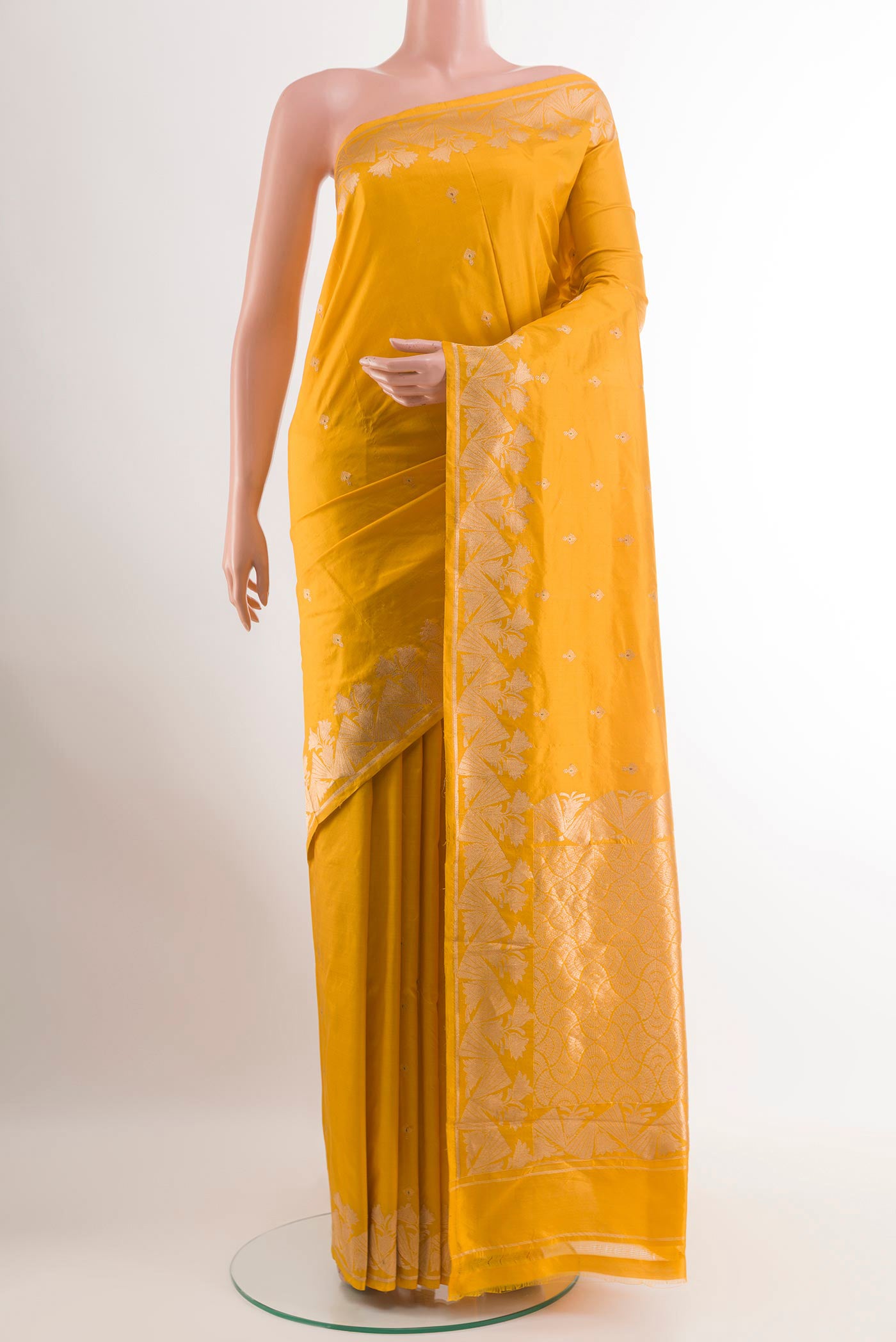 Yellow Banarasi Katan Silk Saree with Zari Butta on the body and Zari Border.  displayed on a mannequin
