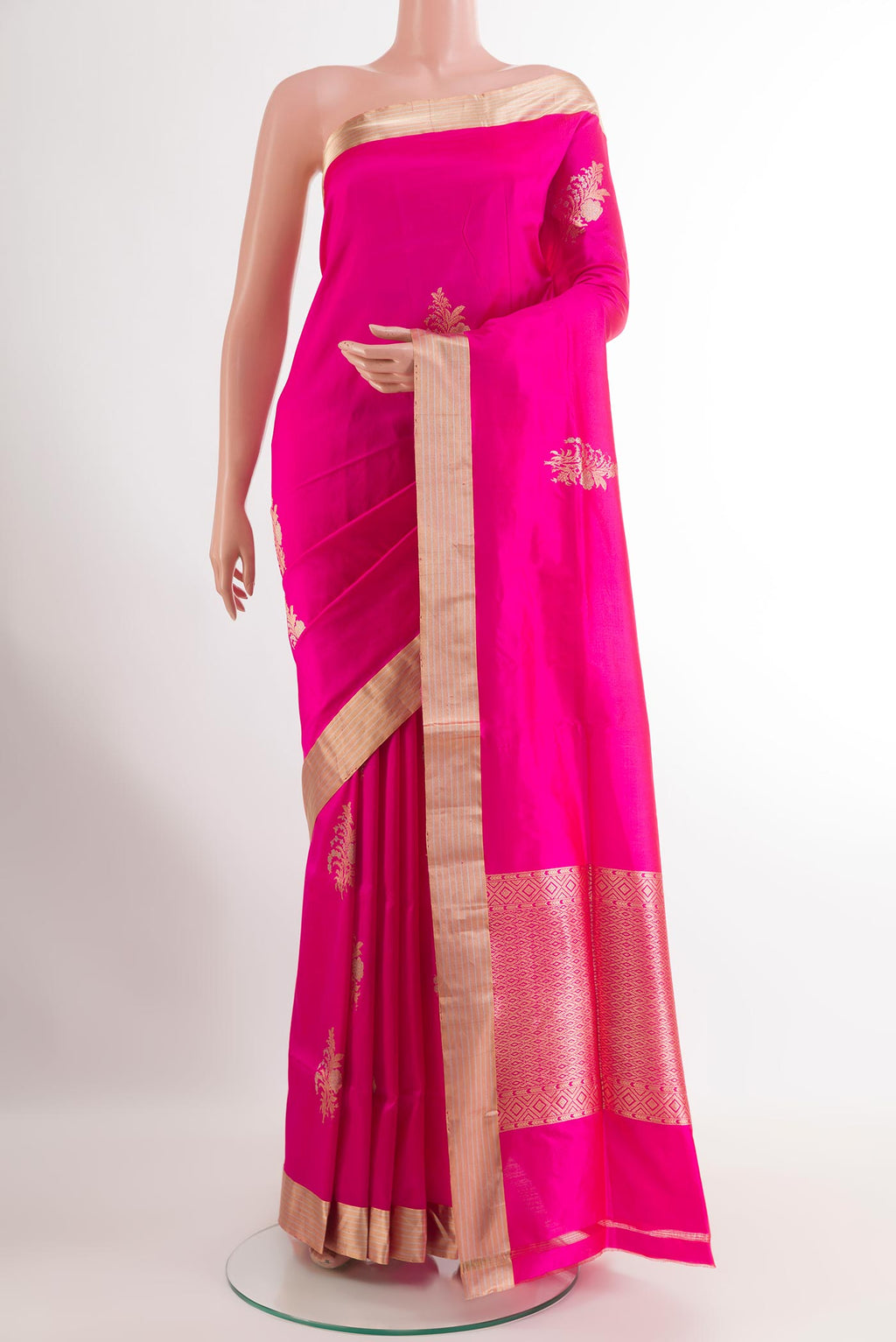 Pink Banarasi Silk Saree with Zari Butta on the body and Zari Border.  displayed on a mannequin