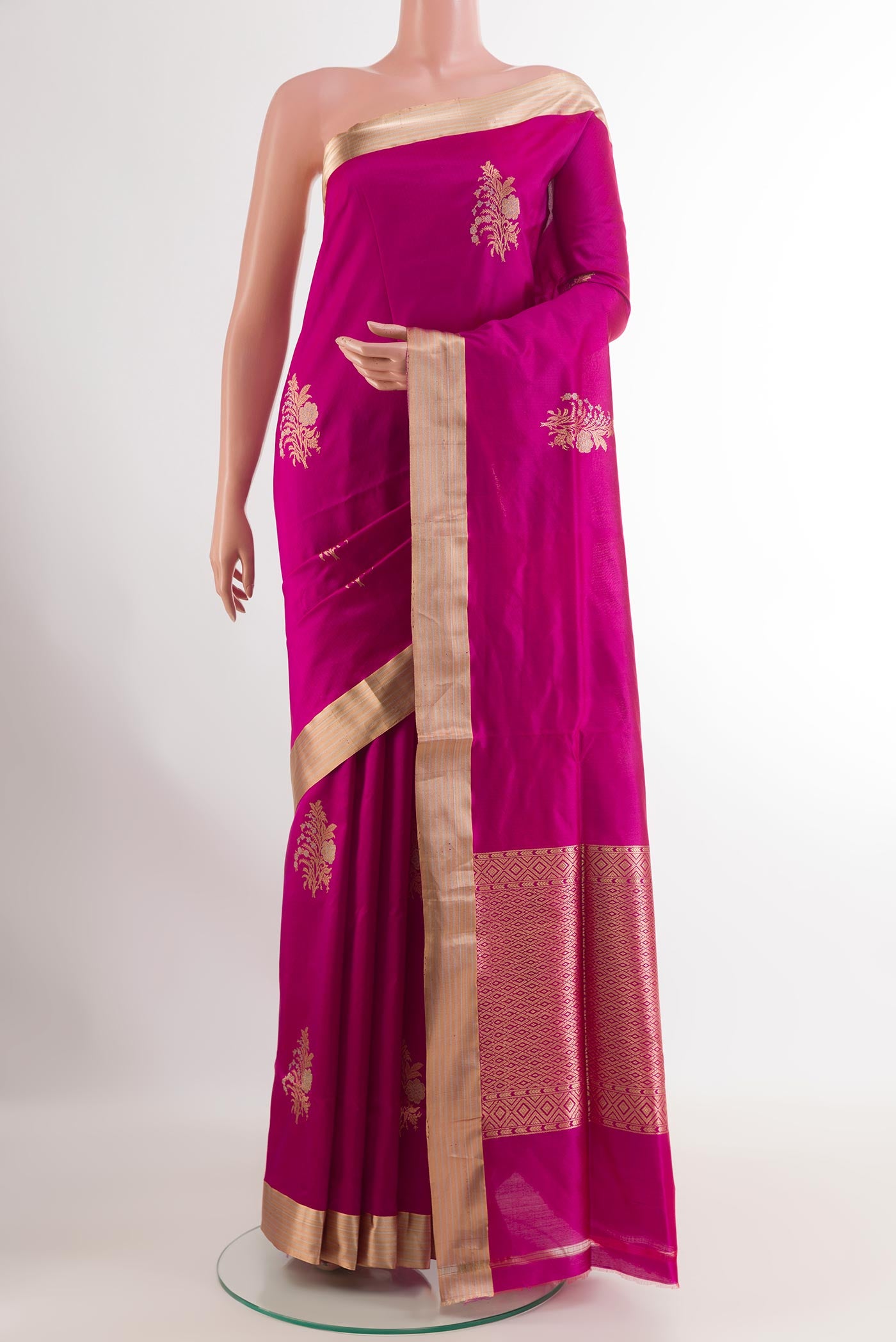 Pink Banarasi Silk Saree with Zari Butta on the body and Zari Border.  displayed on a mannequin