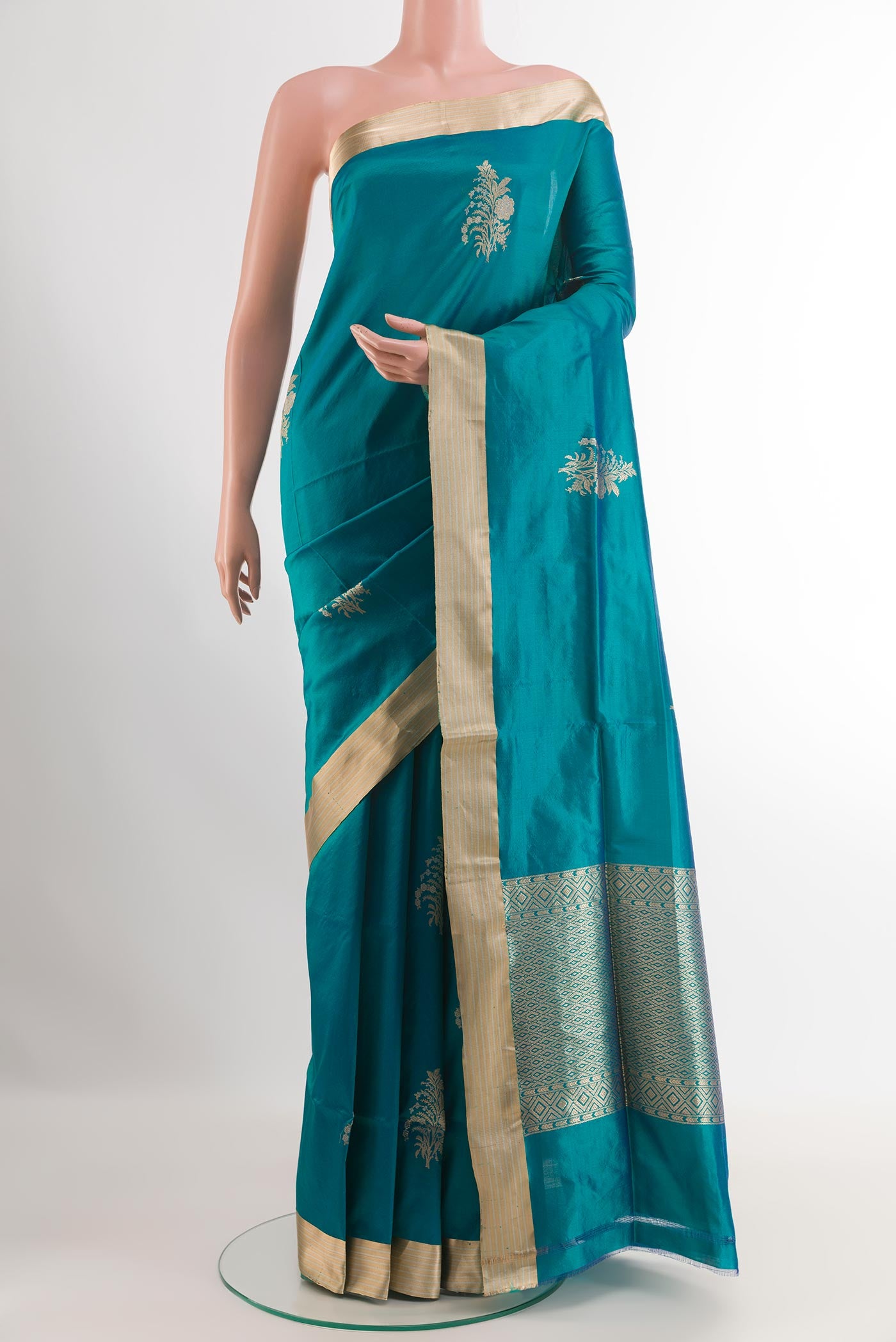 Blue Banarasi Silk Saree with Zari Butta on the body and Zari Border.  displayed on a mannequin