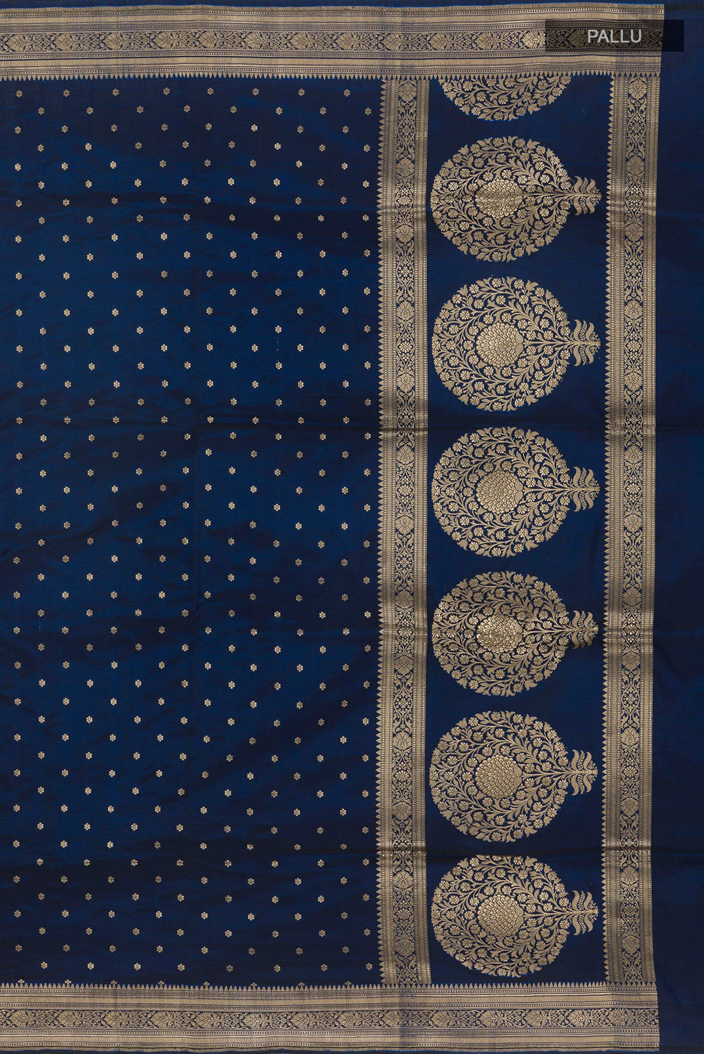 Close up image of the pallu of Blue Banarasi Silk Saree with Zari Butta on the body and Zari Border. 