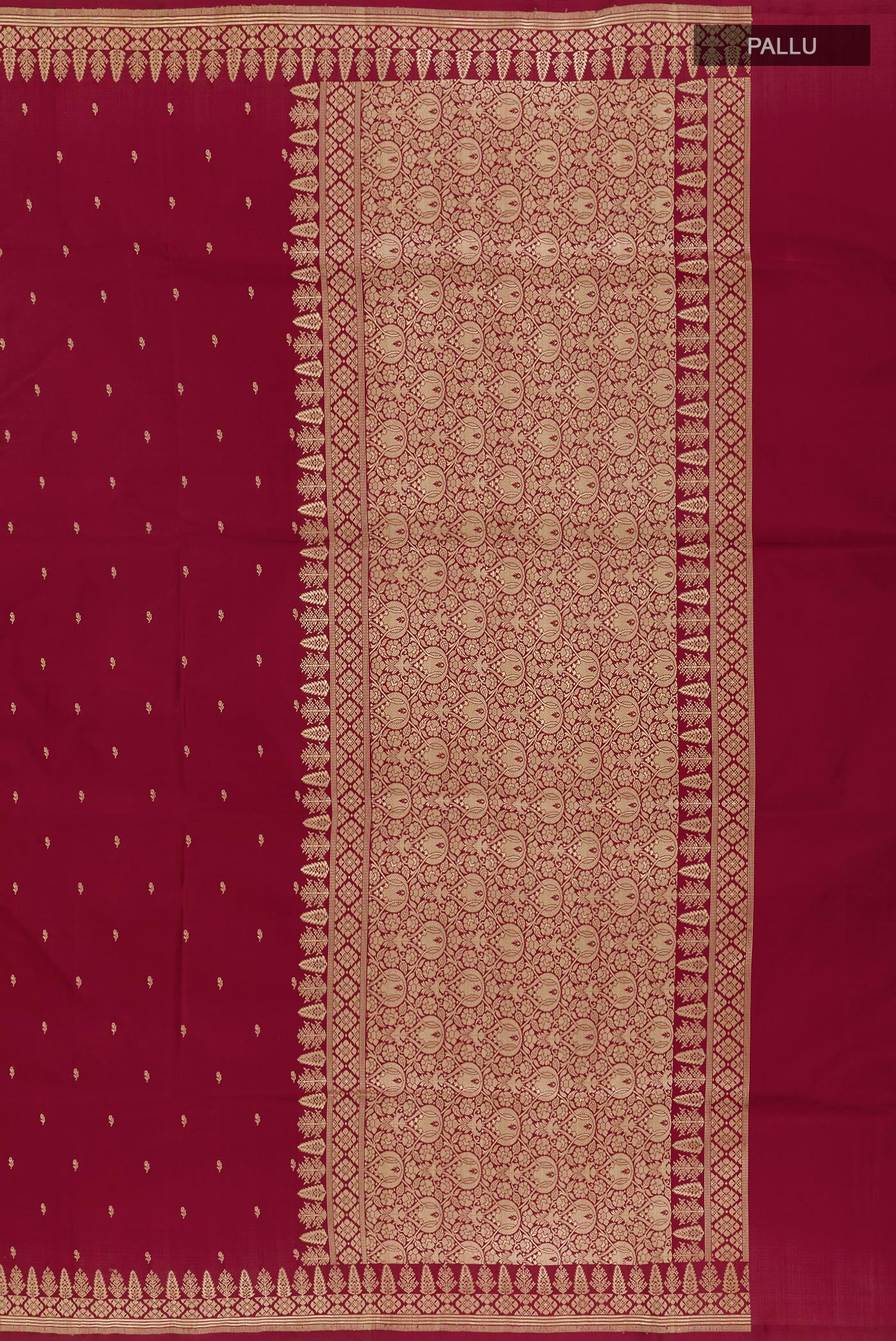 Close up image of the pallu of Maroon Banarasi Silk Saree with Zari Butta on the body and Zari Border. 