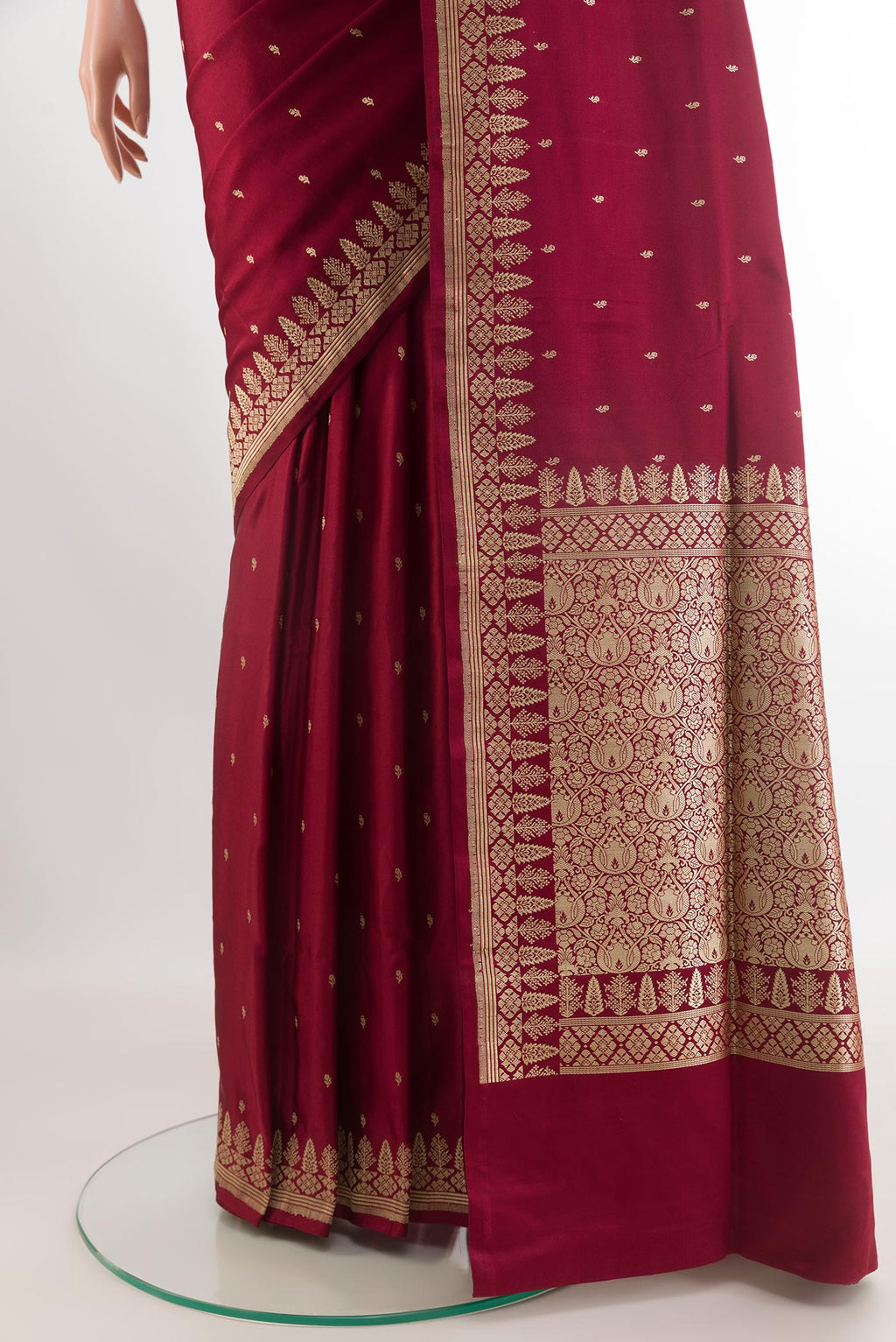 Pleats and pallu of Maroon Banarasi Silk Saree with Zari Butta on the body and Zari Border. 