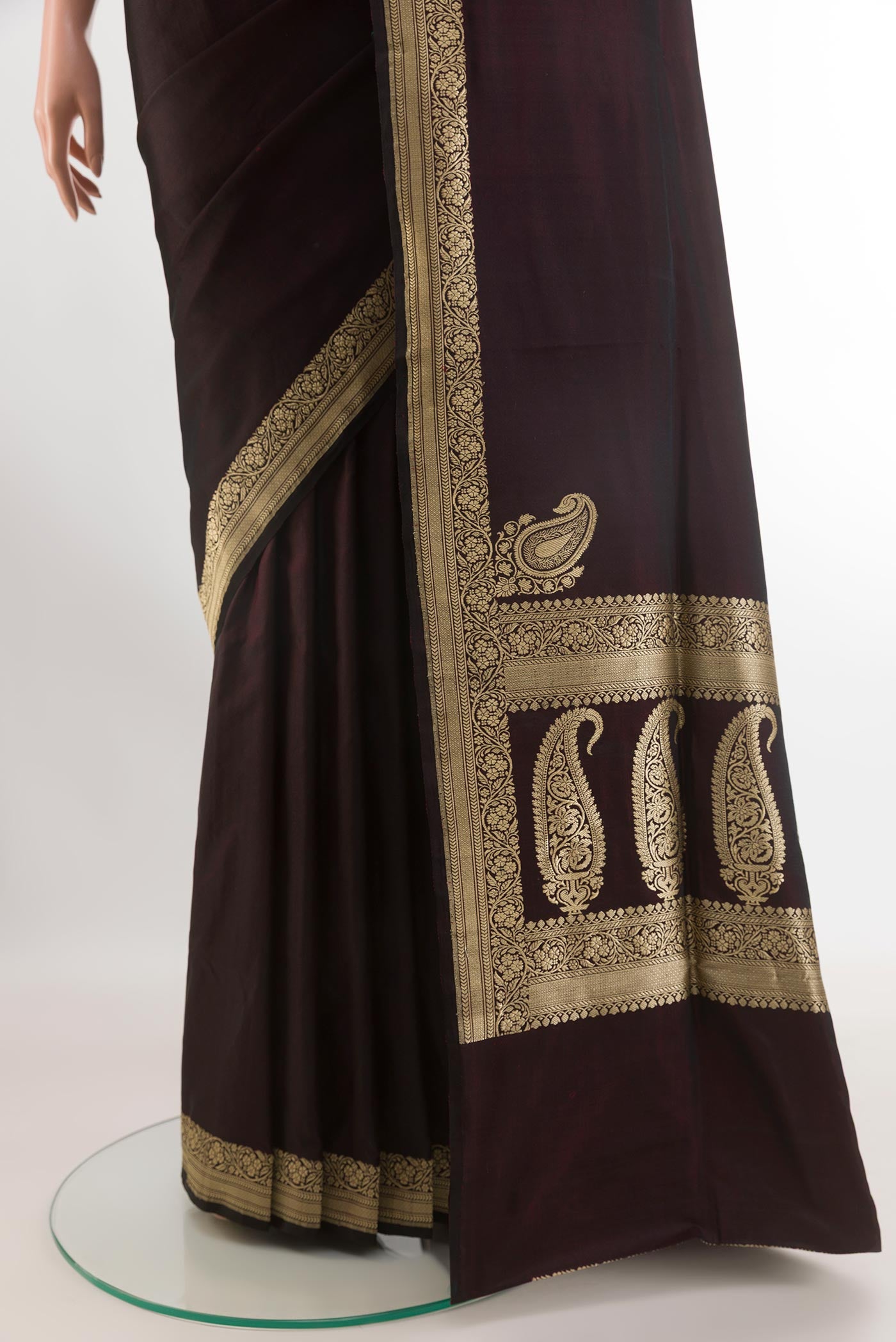 Pleats and pallu of Black Banarasi Silk Saree with Plain Body and Zari Border. 