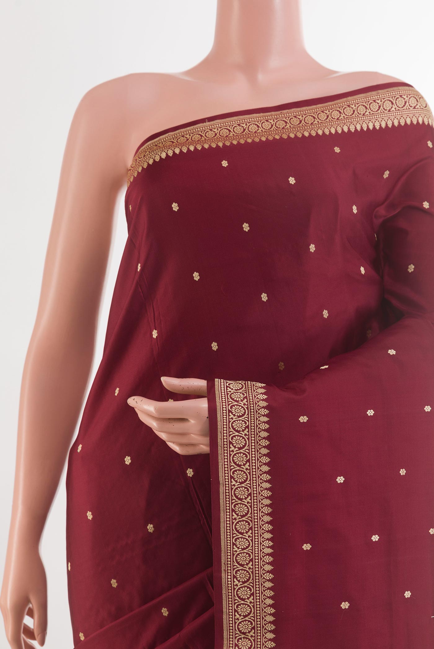 Border image of Maroon Banarasi Silk Saree with Zari Butta on the body and Zari Border. 