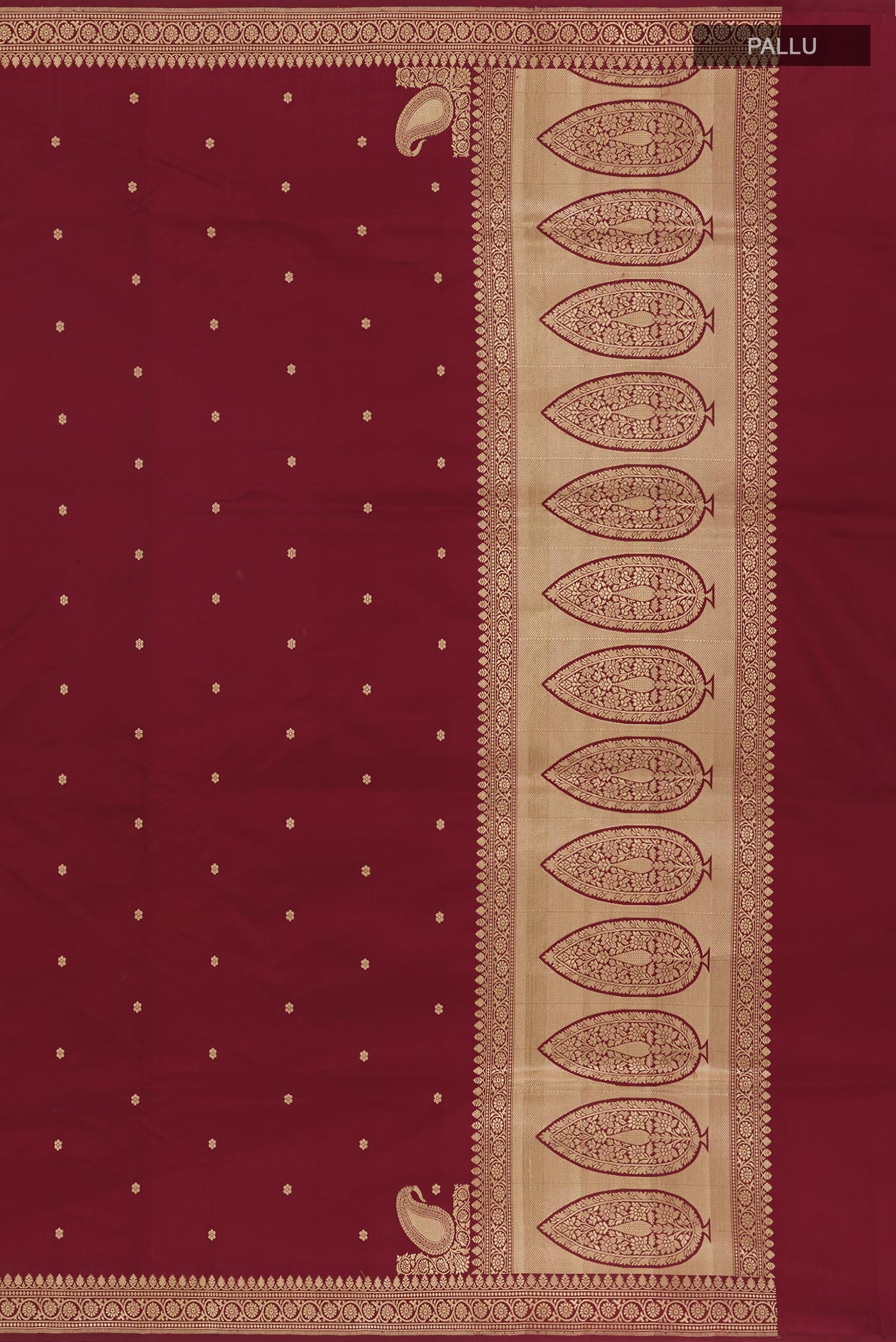 Close up image of the pallu of Maroon Banarasi Silk Saree with Zari Butta on the body and Zari Border. 