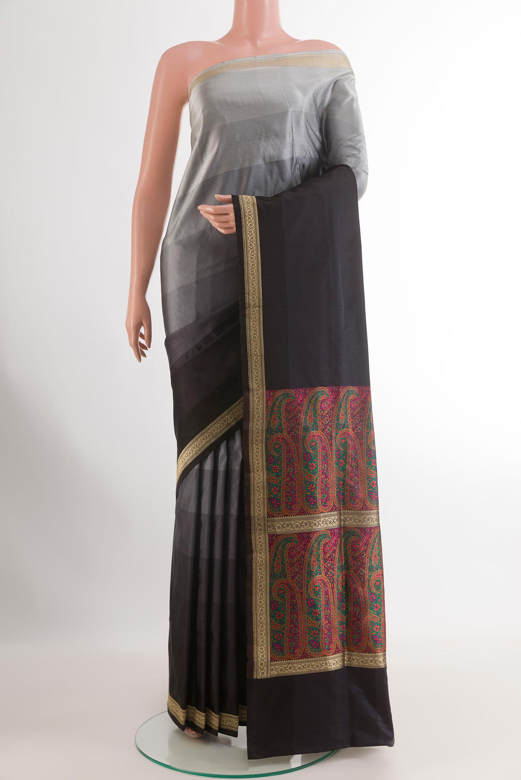Multi Color Banarasi Silk Saree with Stripes on the body and Zari Border.  displayed on a mannequin