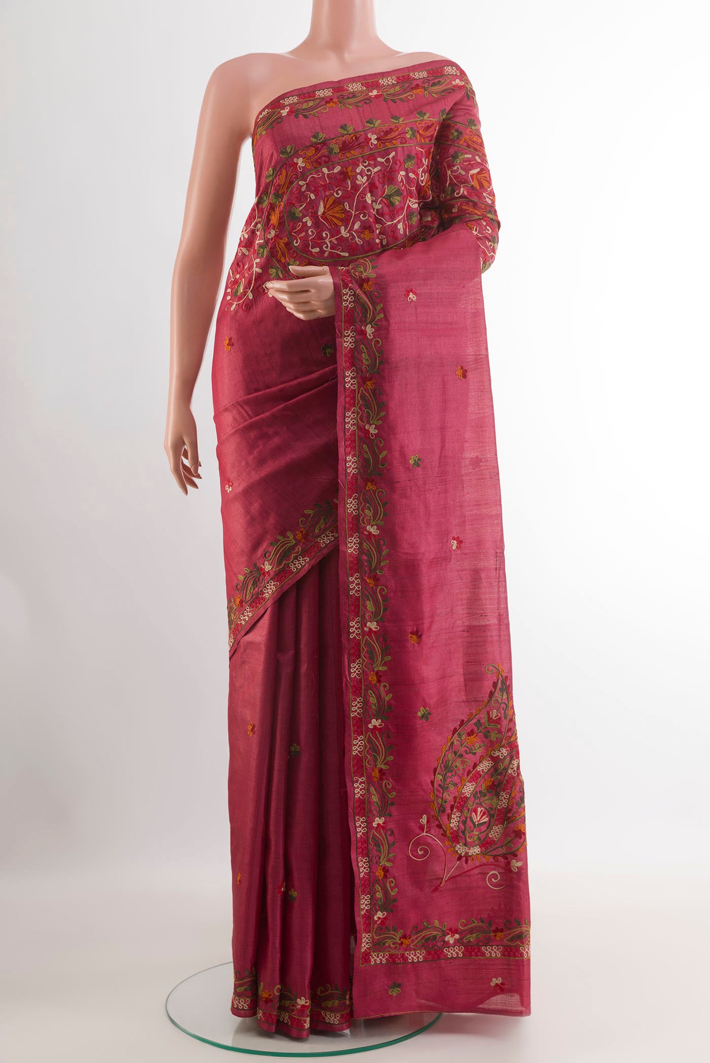 Pink Tussar Saree with Embroidery on the body and Embroidery Border.  displayed on a mannequin