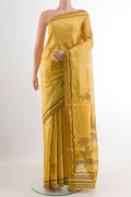 Yellow Tussar Saree with Printed design on the body and Printed Border.  displayed on a mannequin