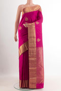 Pink Kanchipuram Silk Saree with Zari Butta on the body and Zari Border.  displayed on a mannequin