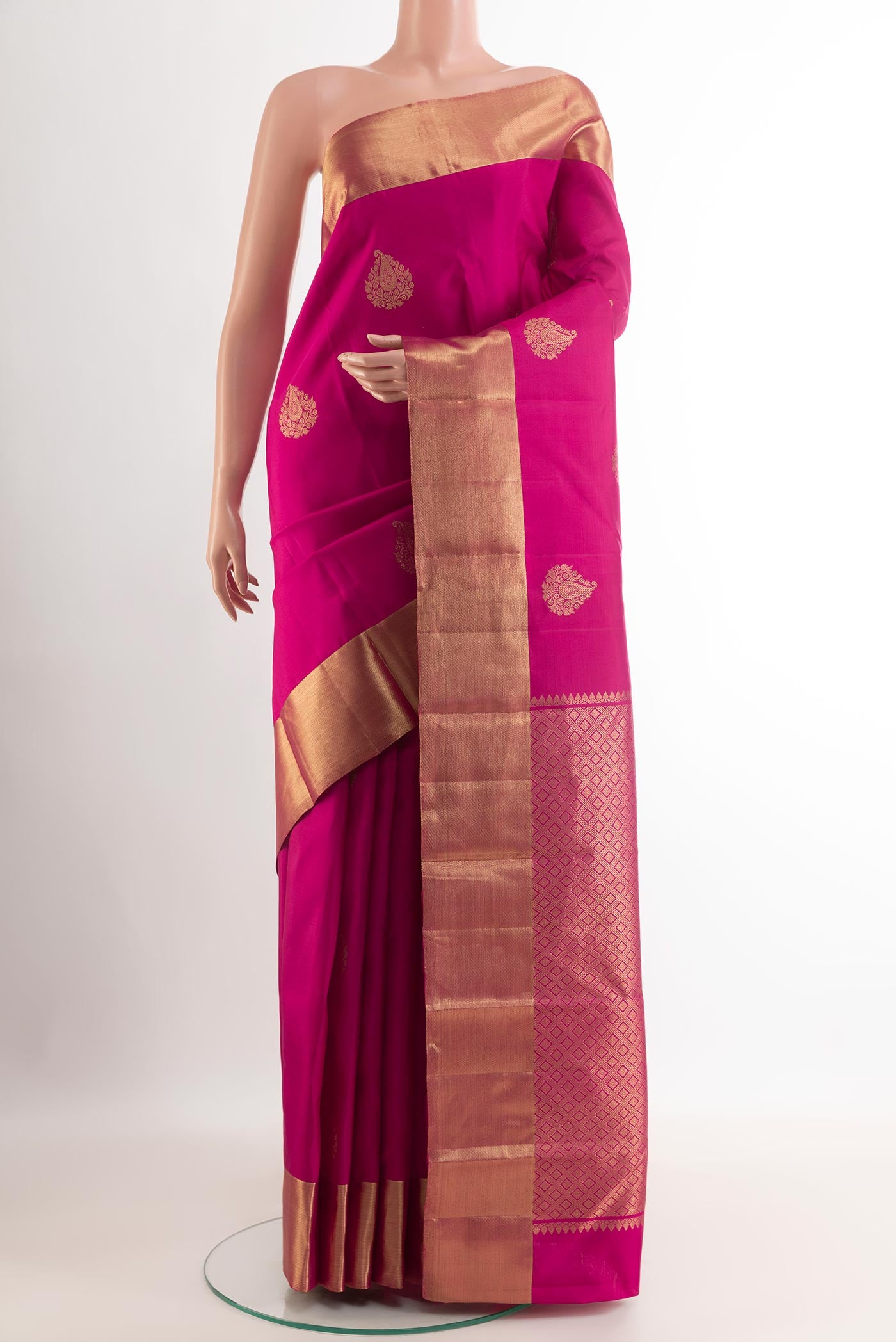 Pink Kanchipuram Silk Saree with Zari Butta on the body and Zari Border.  displayed on a mannequin