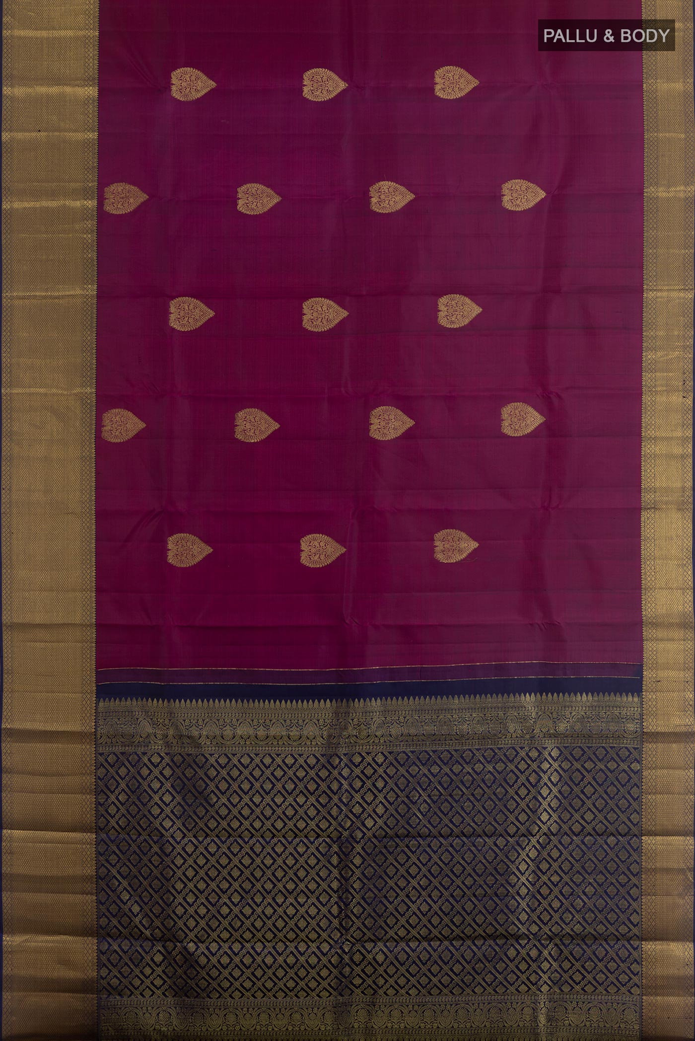 Flat view of Purple Kanchipuram Silk Saree with Zari Butta on the body and Zari Border. 