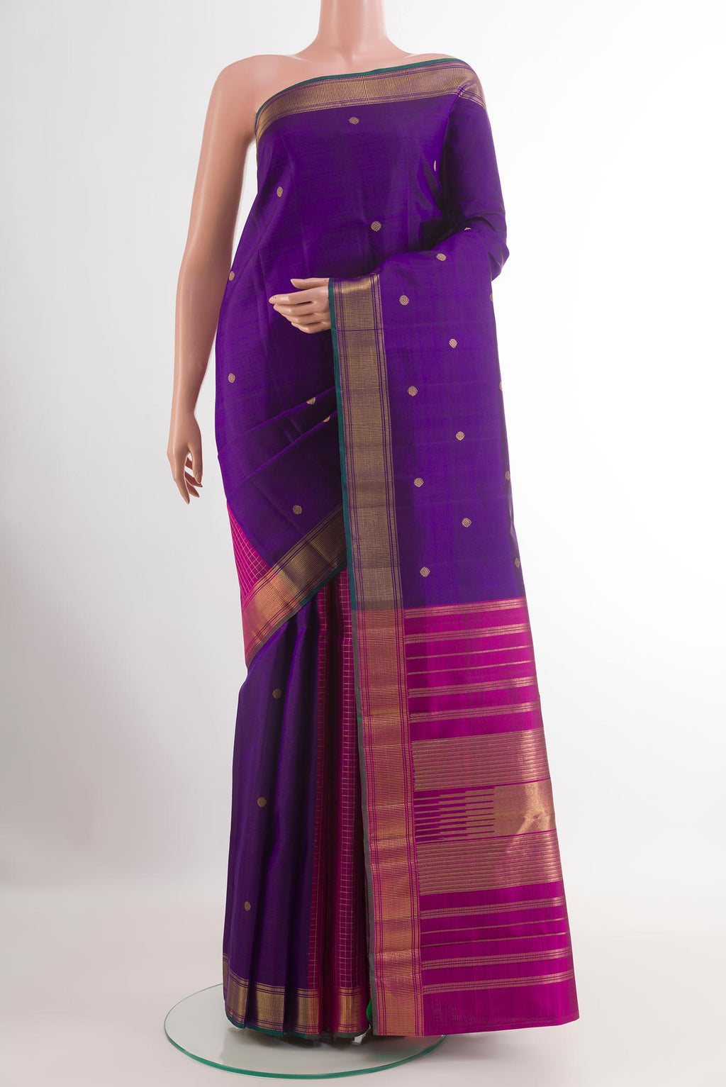 Purple Kanchipuram Silk Saree with Zari Butta on the body and Zari Border.  displayed on a mannequin