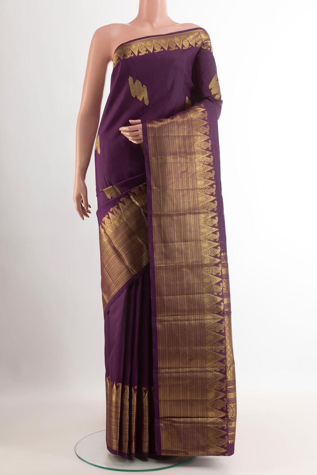 Purple Kanchipuram Silk Saree with Zari Butta on the body and Zari Border.  displayed on a mannequin