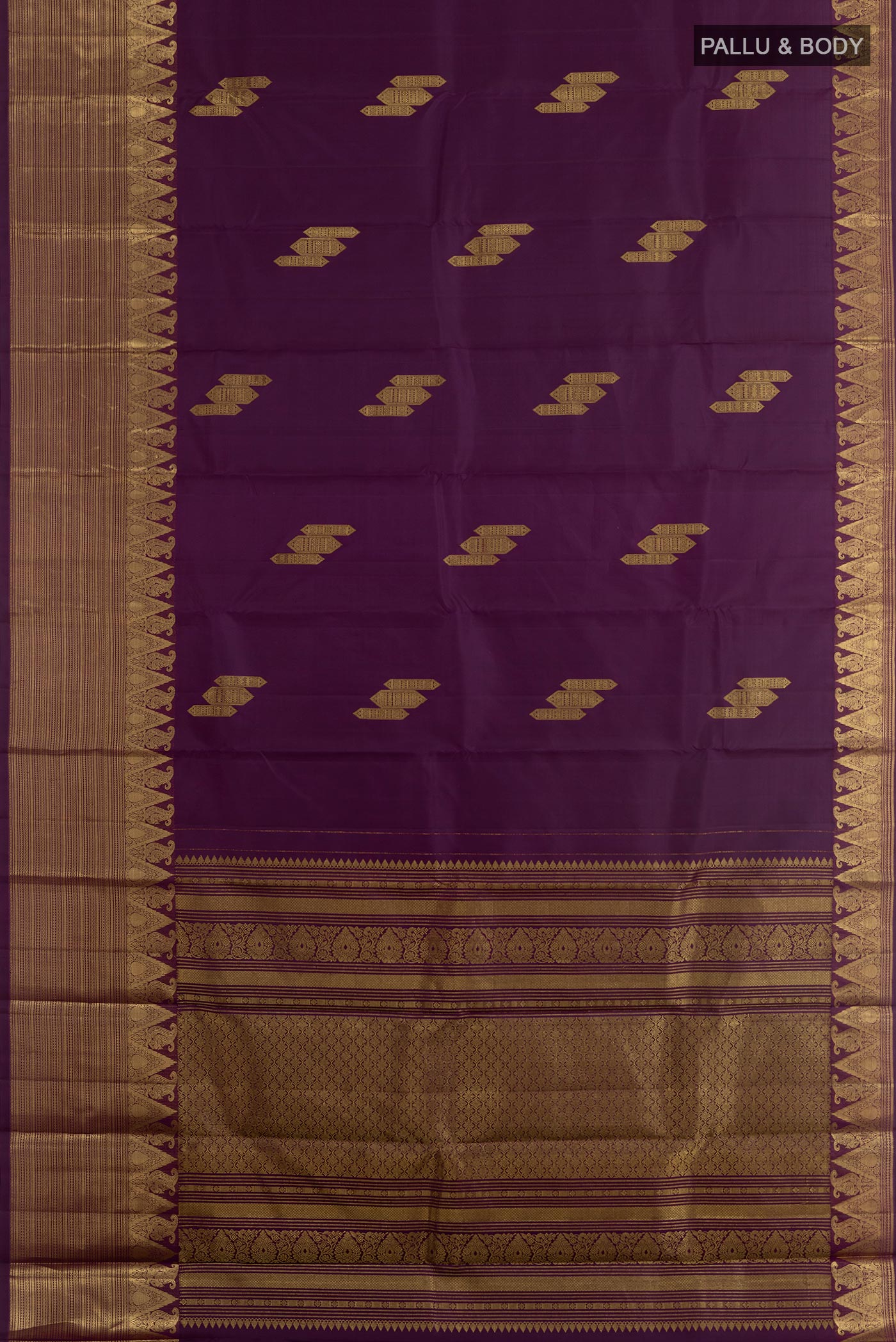 Flat view of Purple Kanchipuram Silk Saree with Zari Butta on the body and Zari Border. 