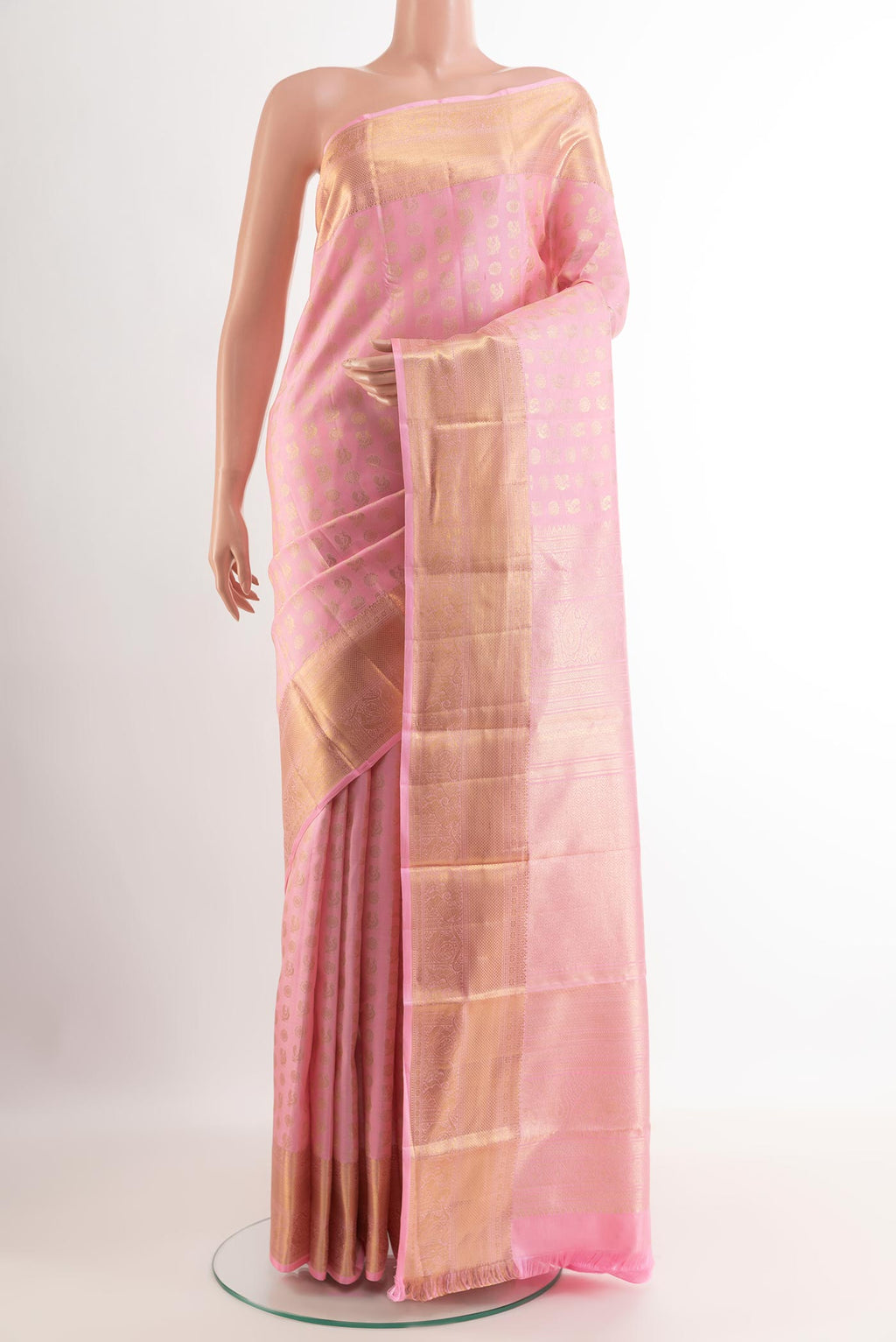 Pink Kanchipuram Silk Saree with Zari Butta on the body and Zari Border.  displayed on a mannequin