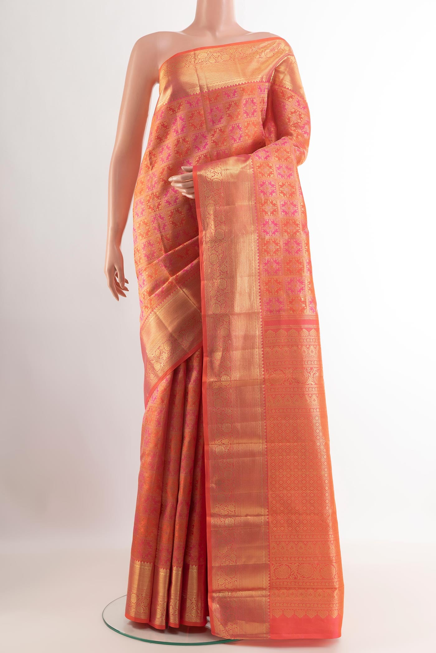 Pink Kanchipuram Silk Saree with Zari Brocade on the body and Zari Border.  displayed on a mannequin