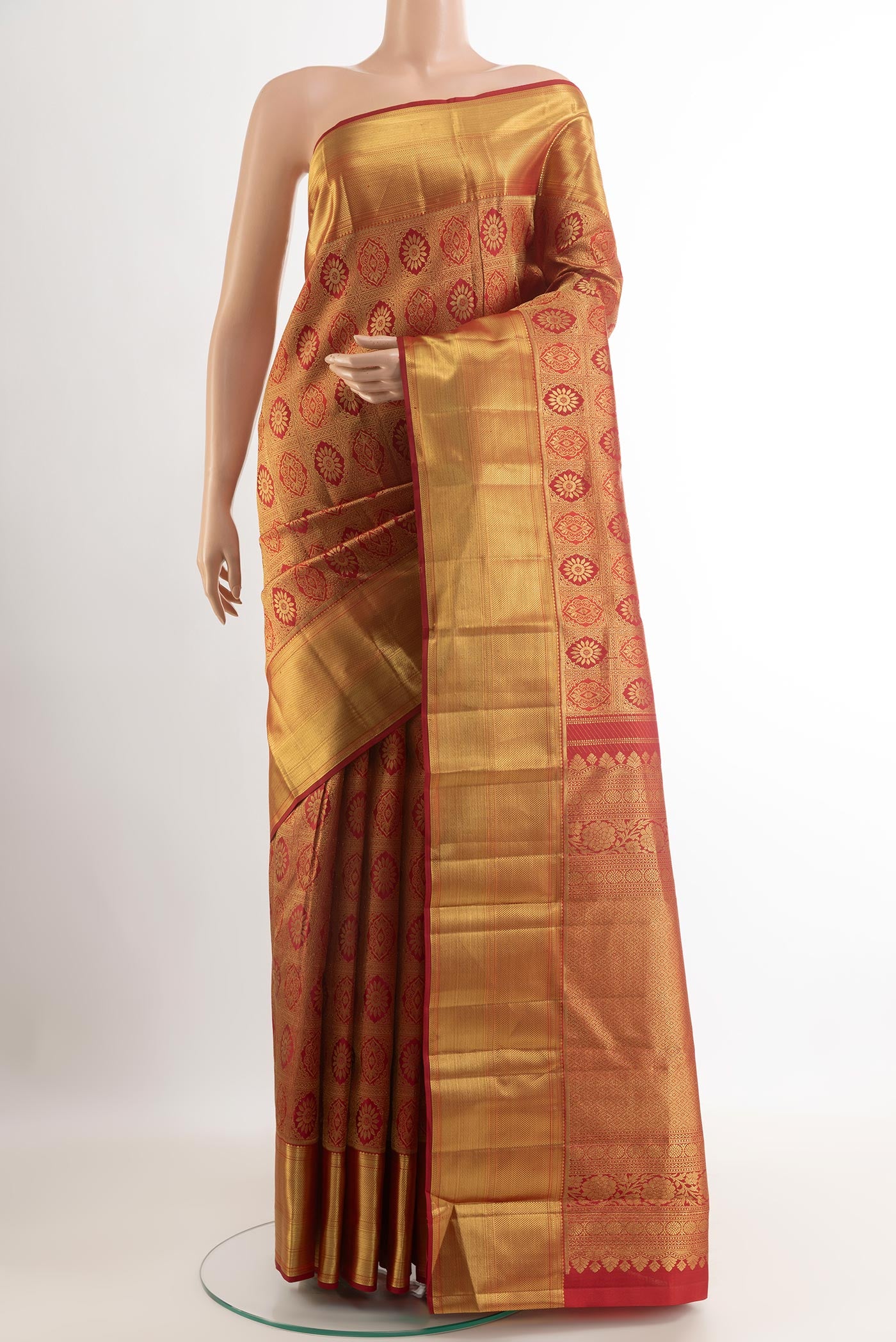 Maroon Kanchipuram Silk Saree with Zari Brocade on the body and Zari Border.  displayed on a mannequin