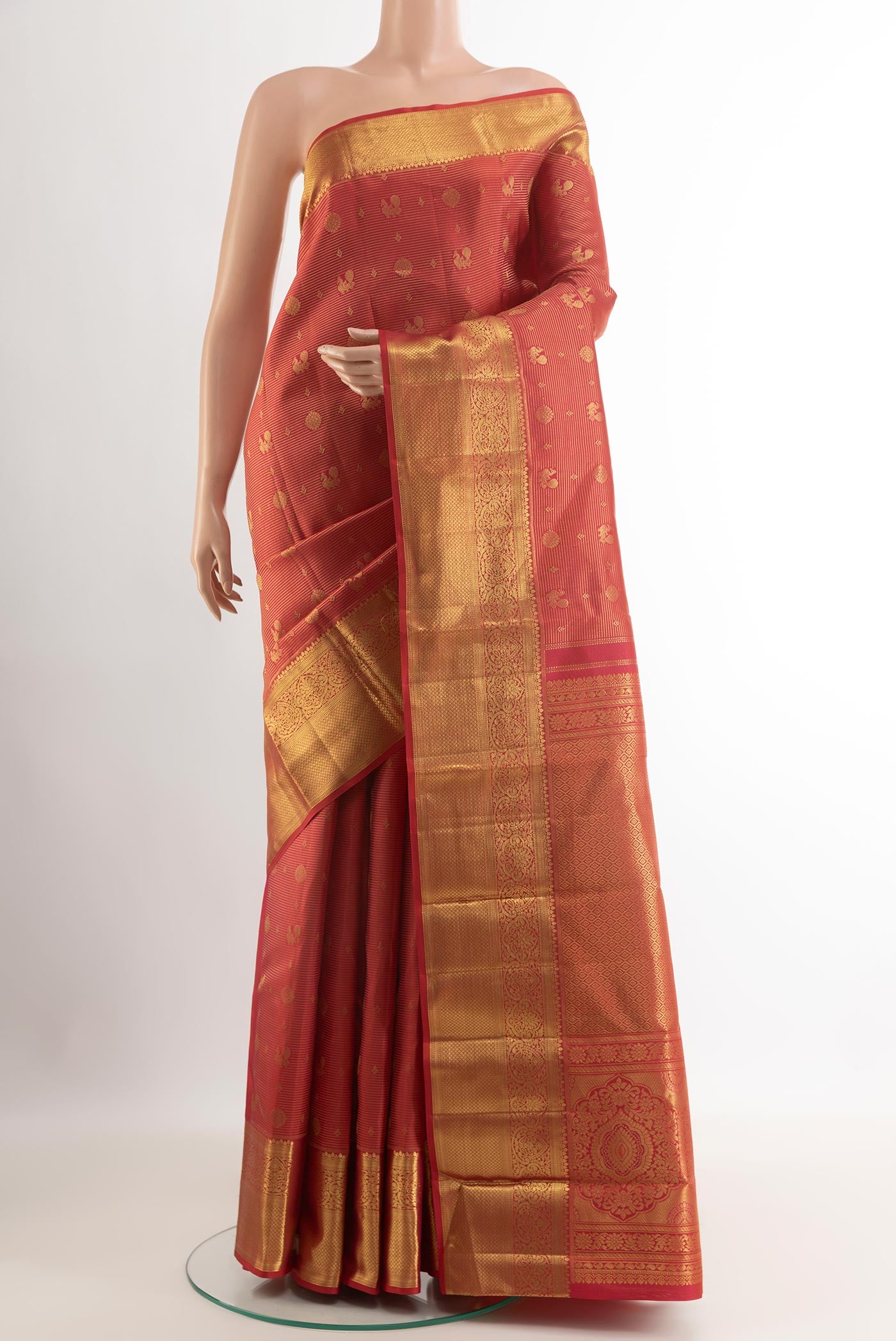 Red Kanchipuram Silk Saree with Zari Butta on the body and Zari Border.  displayed on a mannequin