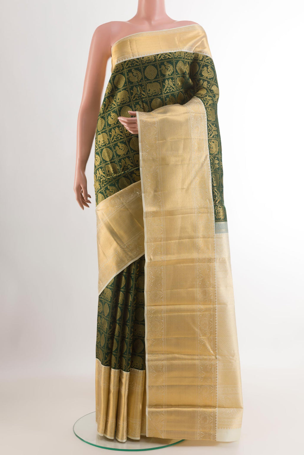 Green Kanjivaram Silk Saree with Zari Brocade on the body and Zari Border.  displayed on a mannequin