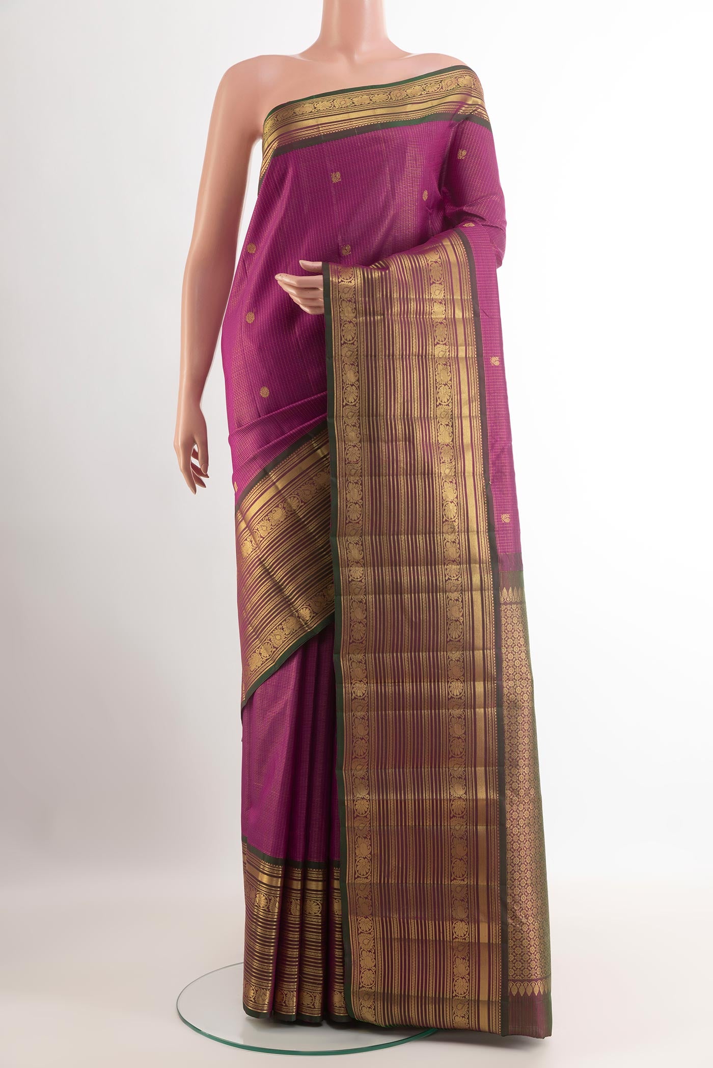 Purple Kanchipuram Silk Saree with Zari Butta on the body and Zari Border.  displayed on a mannequin