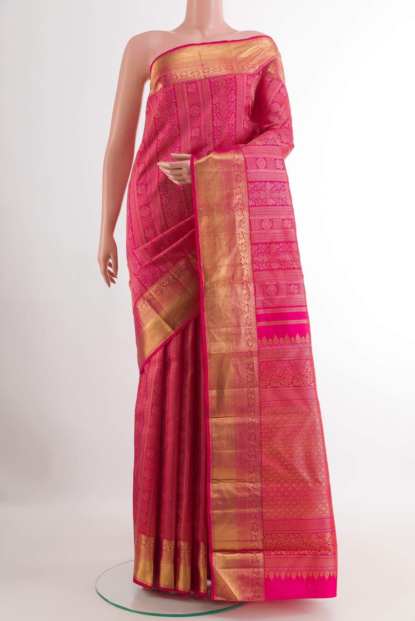 Pink Kanjivaram Silk Saree with Zari Brocade on the body and Zari Border.  displayed on a mannequin