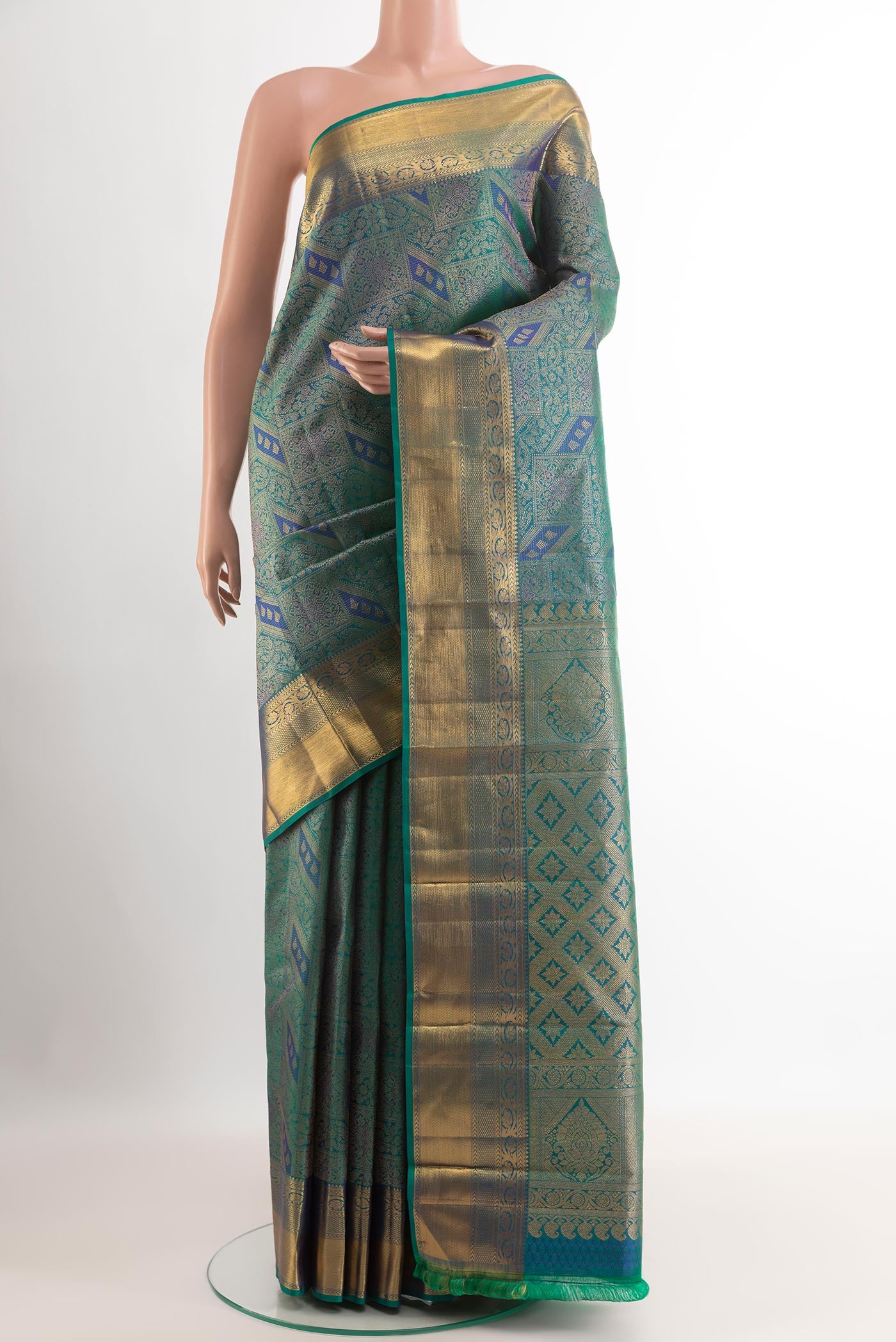 Sea Green Kanjivaram Silk Saree with Zari Brocade on the body and Zari Border.  displayed on a mannequin