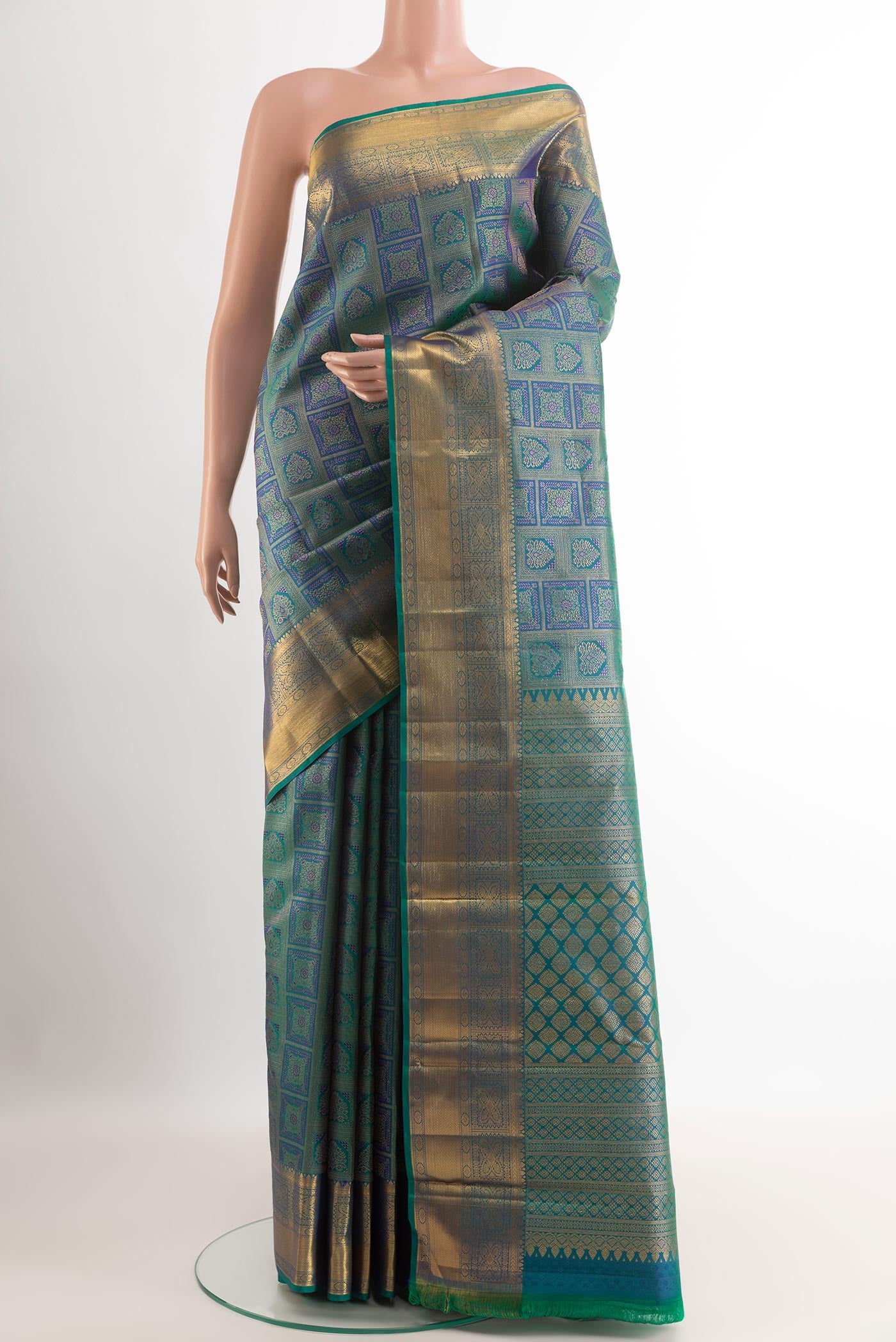Sea Green Kanjivaram Silk Saree with Zari Brocade on the body and Zari Border.  displayed on a mannequin
