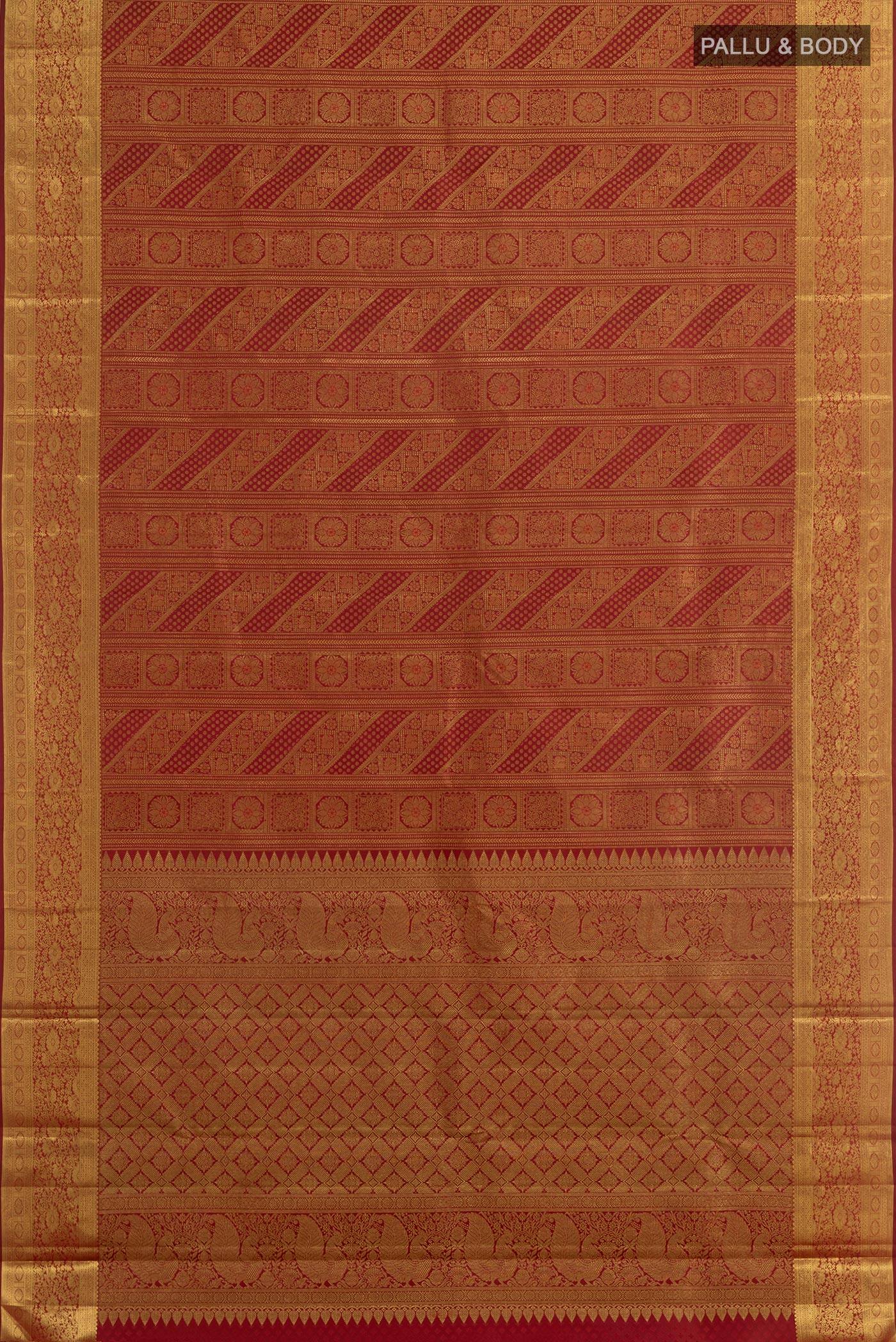 Flat view of Maroon Kanjivaram Silk Saree with Zari Brocade on the body and Zari Border. 