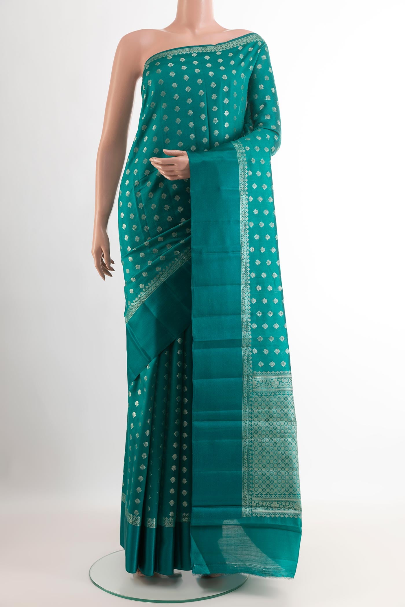 Sea Green Tussar Silk Saree with Zari Butta on the body and Zari Border.  displayed on a mannequin