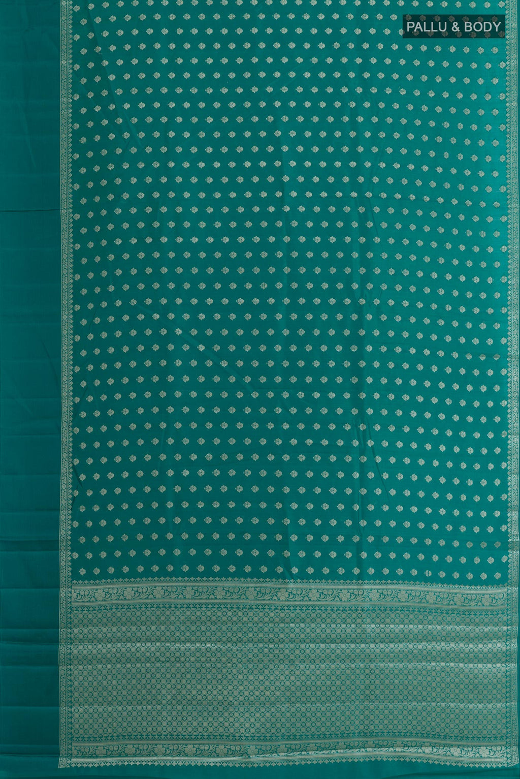 Flat view of Sea Green Tussar Silk Saree with Zari Butta on the body and Zari Border. 