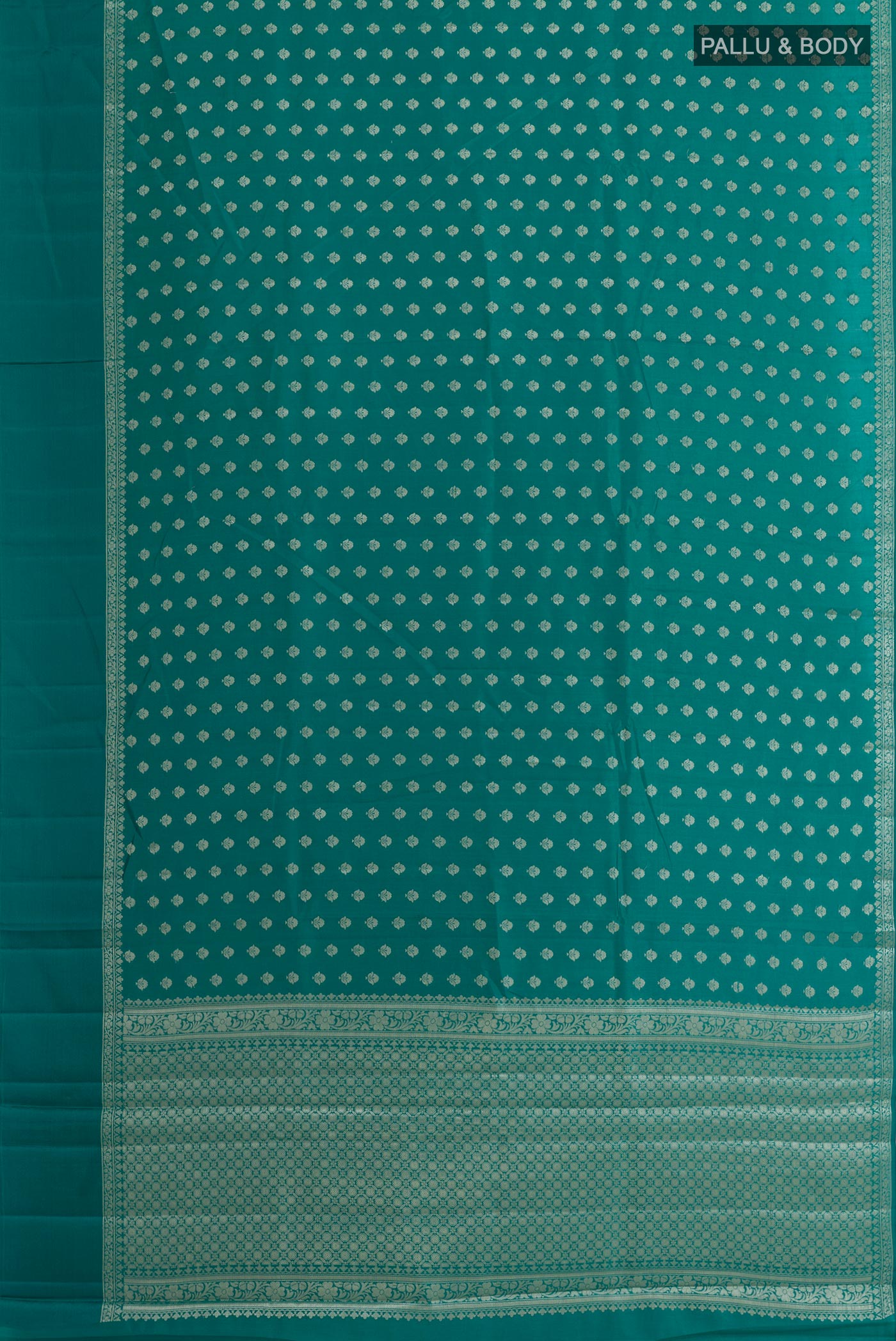 Flat view of Sea Green Tussar Silk Saree with Zari Butta on the body and Zari Border. 