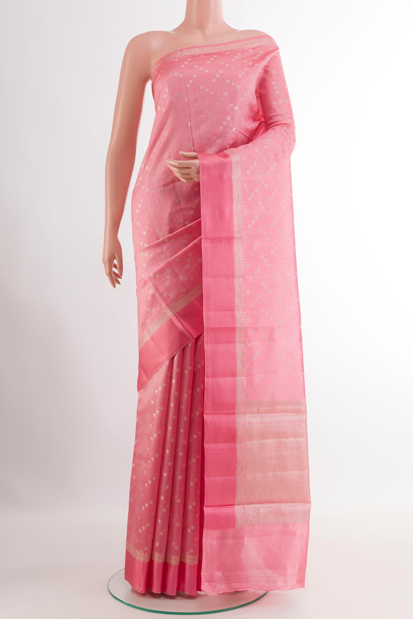 Pink Tussar Silk Saree with Zari Butta on the body and Zari Border.  displayed on a mannequin
