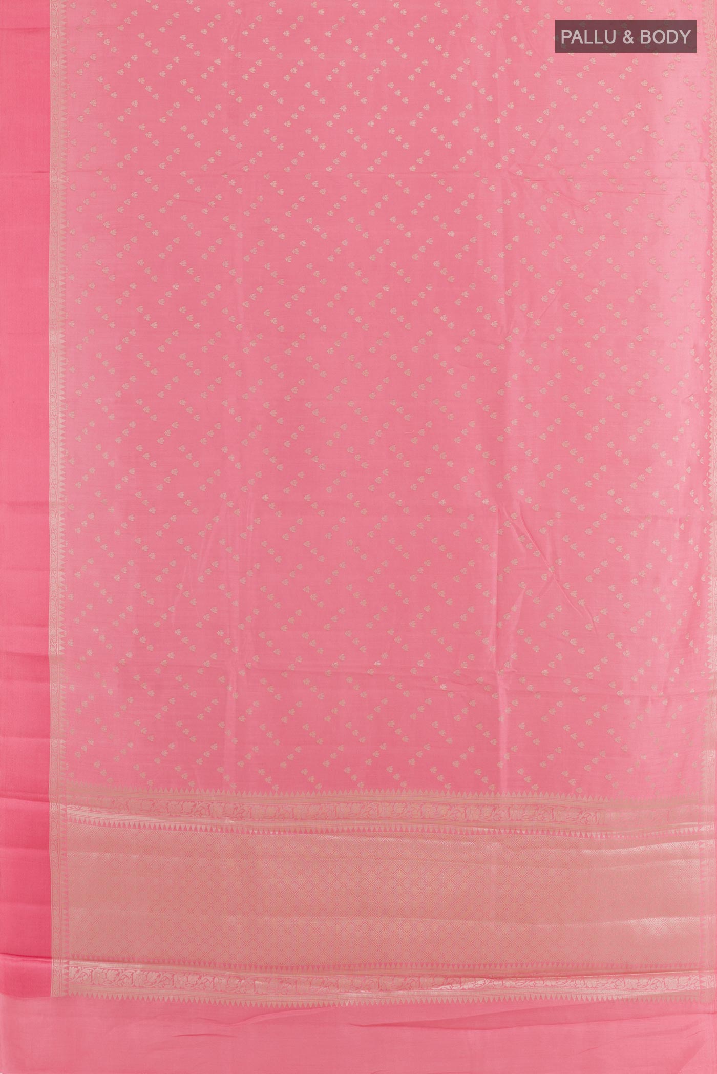 Flat view of Pink Tussar Silk Saree with Zari Butta on the body and Zari Border. 
