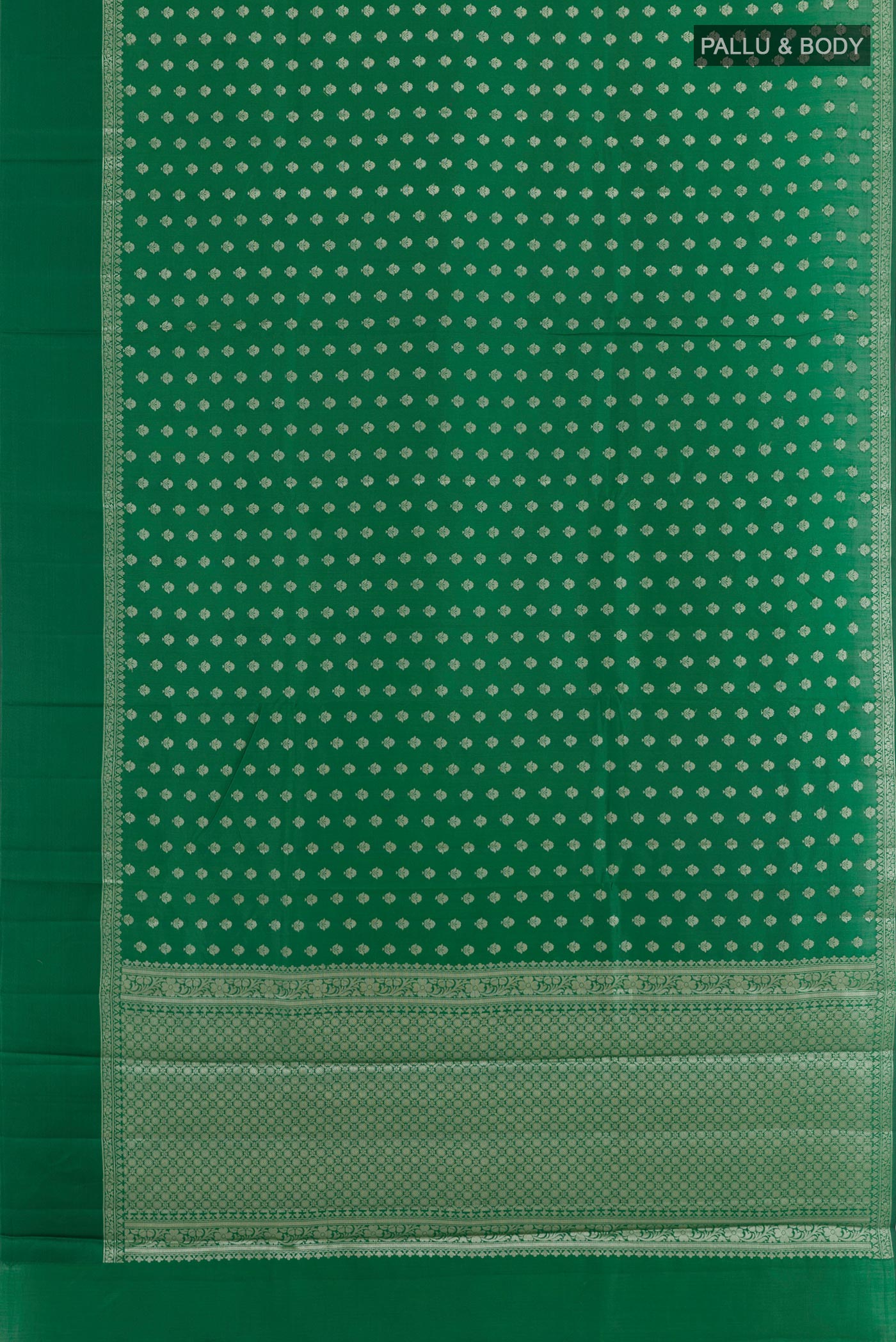 Flat view of Green Tussar Silk Saree with Zari Butta on the body and Zari Border. 